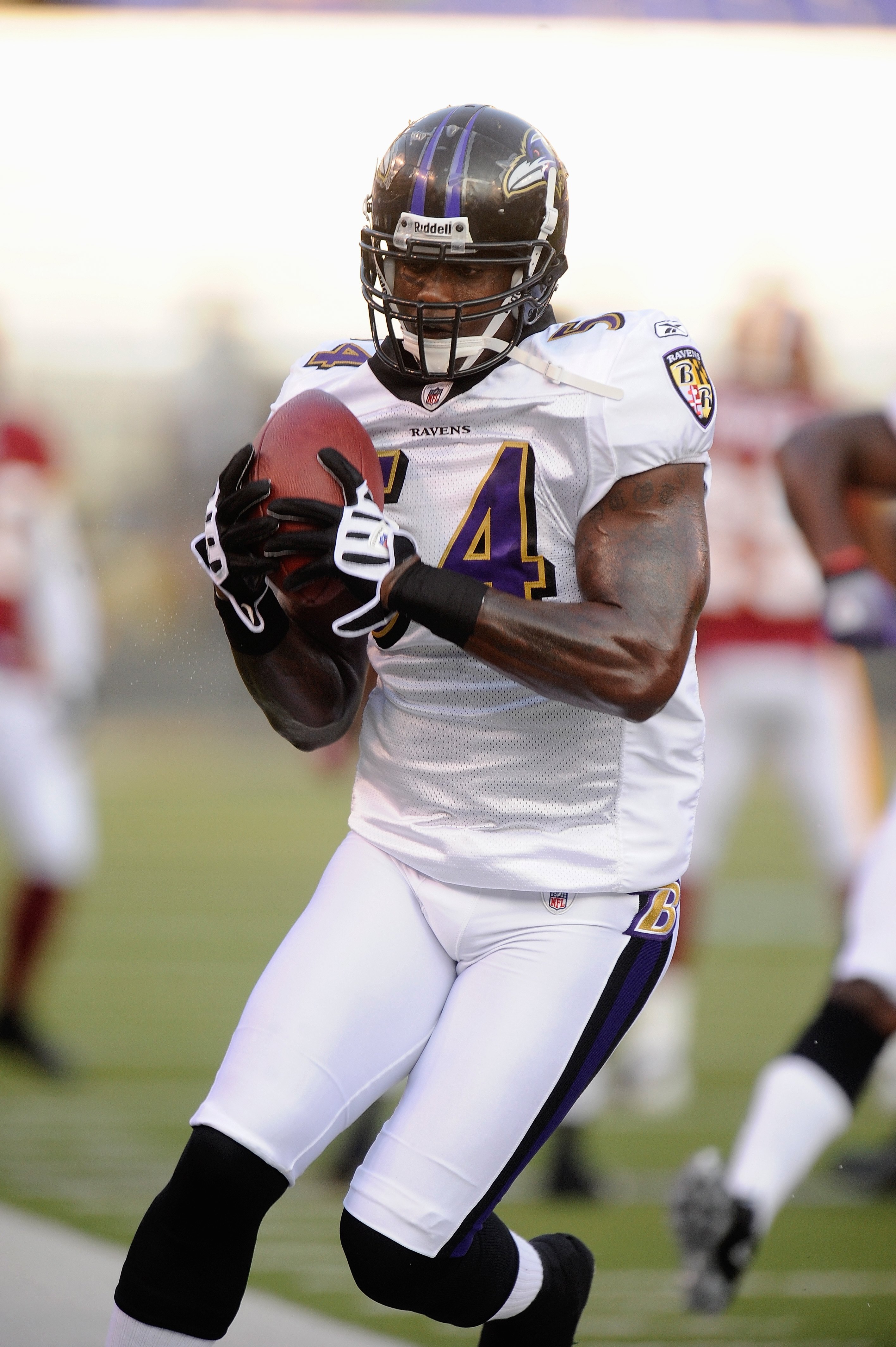 BALTIMORE, MD - AUGUST 13:  Prescott Burgess #54 of the Baltimore Ravens during warm ups of a NFL preseason football game against the Washington Redskins on August 13, 2009 at M & T Bank Stadium in Baltimore, Maryland.   (Photo by Mitchell Layton/Getty Im