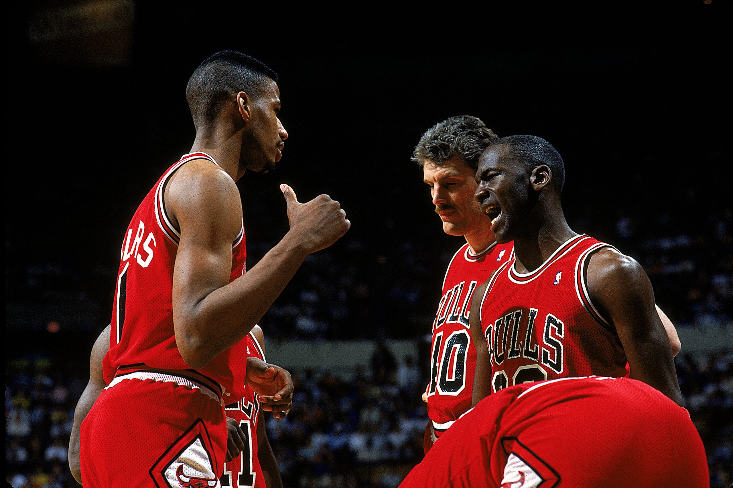 1987-1988:  Michael Jordan #23 of the Chicago Bulls talks to teammates during the game.   Mandatory Credit: Andy Lyons  /Allsport