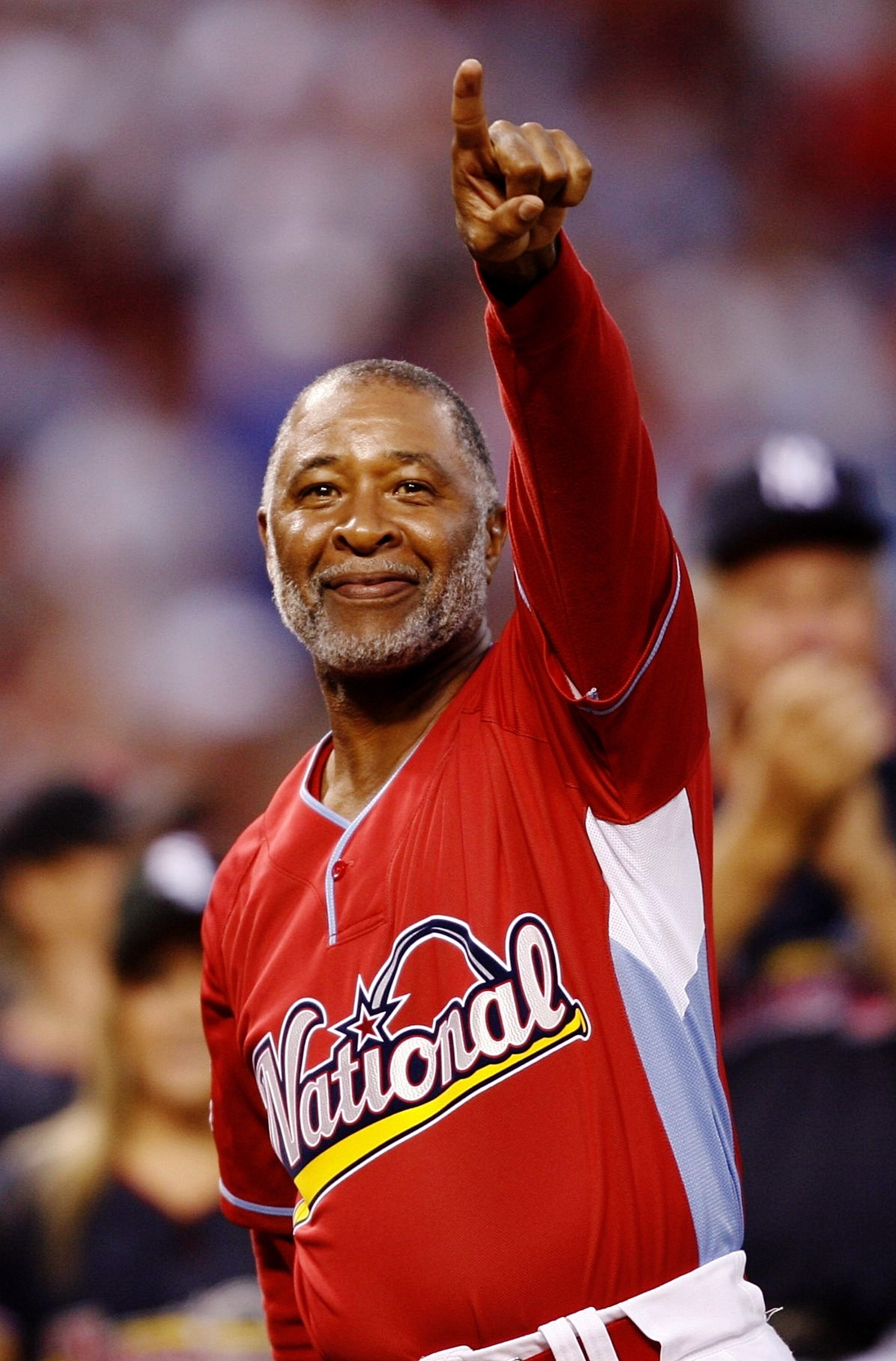 ST. LOUIS - JULY 12: Hall of famer Ozzie Smith gestures to the crowd during the Taco Bell All-Star Legends & Celebrity Softball Game at Busch Stadium on July 12, 2009 in St. Louis, Missouri. (Photo by Dilip Vishwanat/Getty Images)