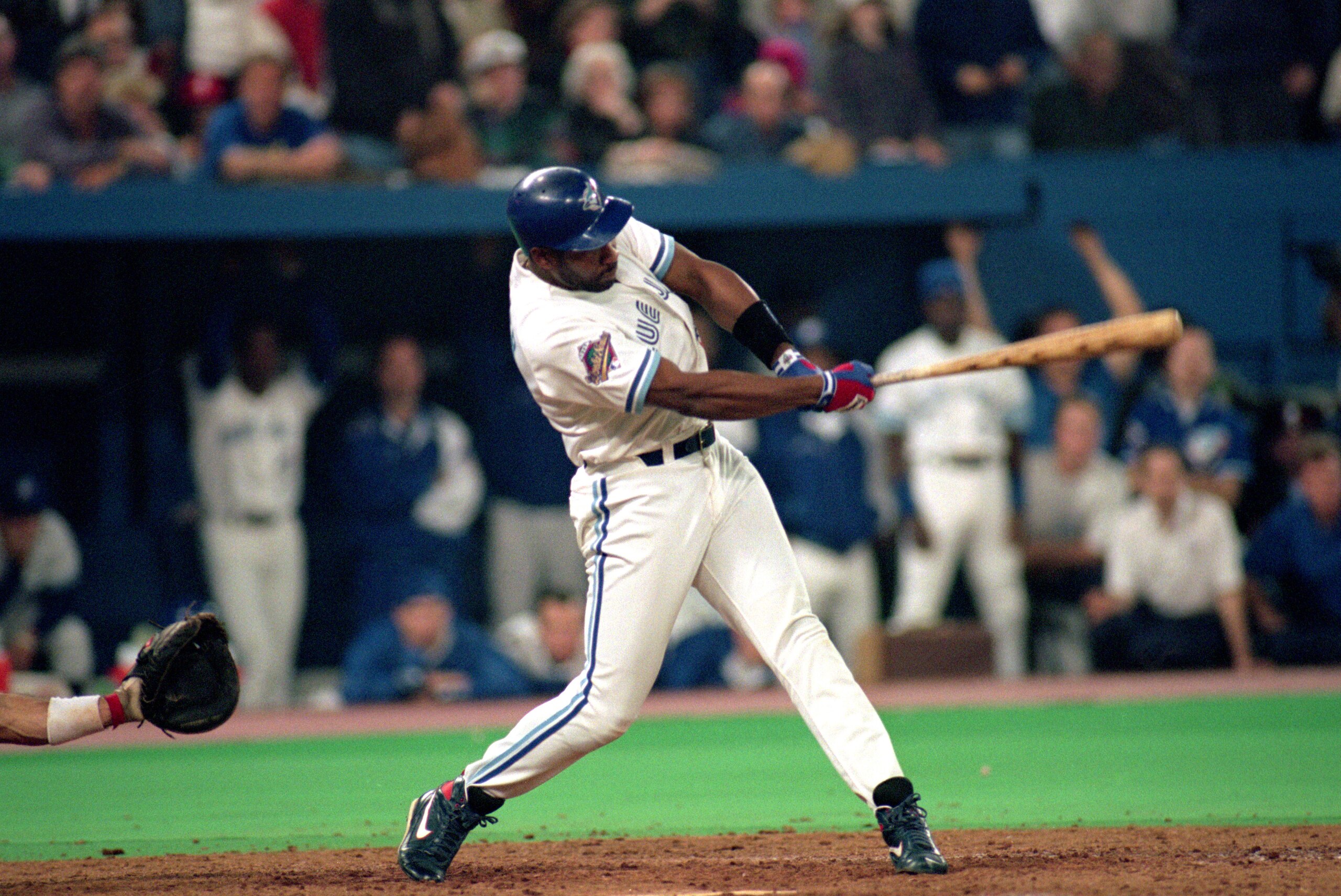 TORONTO - OCTOBER 23:  Joe Carter #29 of the Toronto Blue Jays hits a game winning three-run home run against the Philadelphia Phillies in game six of the 1993 World Series at Skydome on October 23, 1993 in Toronto, Ontario, Canada. The Blue Jays defeated