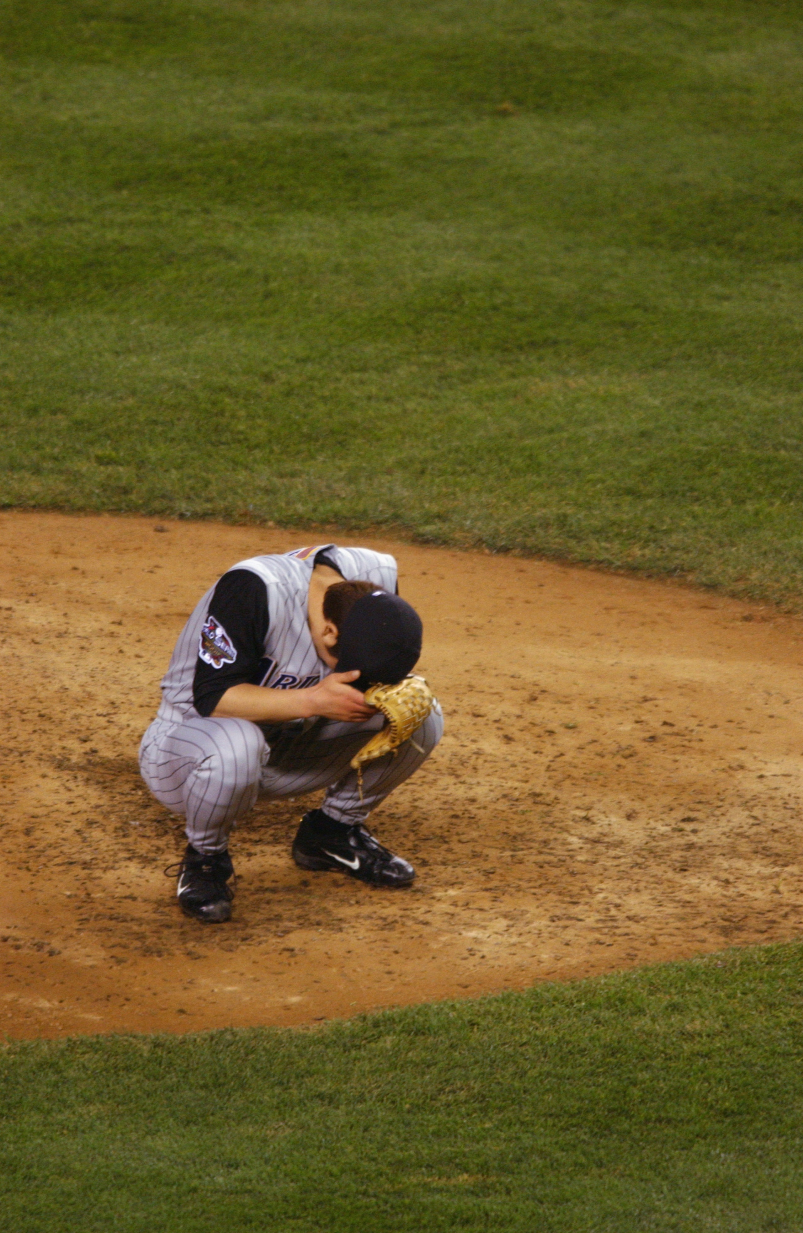 NEW YORK - NOVEMBER 01:  Pitcher Byung-Hyun Kim #49 of the Arizona Diamonbacks sits on the mound after giving up a two run home run to Scott Brosius #18 of the New York Yankees to tie the game in the ninth inning during game five of the 2001 World Series
