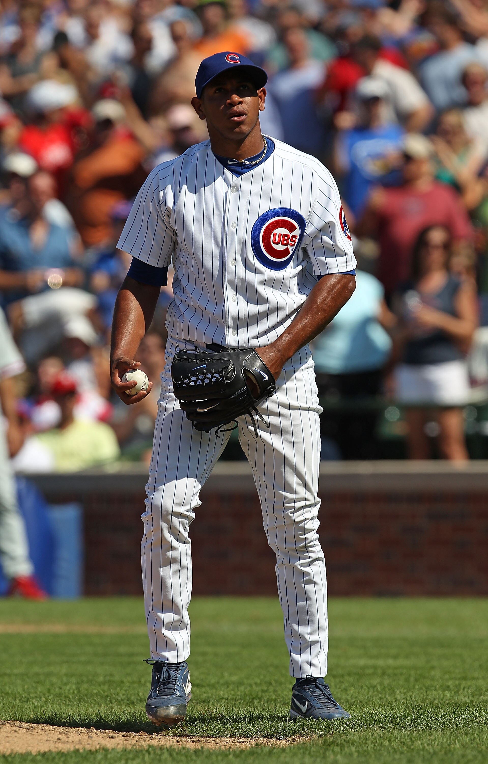 CHICAGO - JULY 16: Carlos Marmol #49 of the Chicago Cubs waits to pitch in the 9th inning against the Philadelphia Phillies at Wrigley Field on July 16, 2010 in Chicago, Illinois. The Cubs defeated the Phillies 4-3. (Photo by Jonathan Daniel/Getty Images)