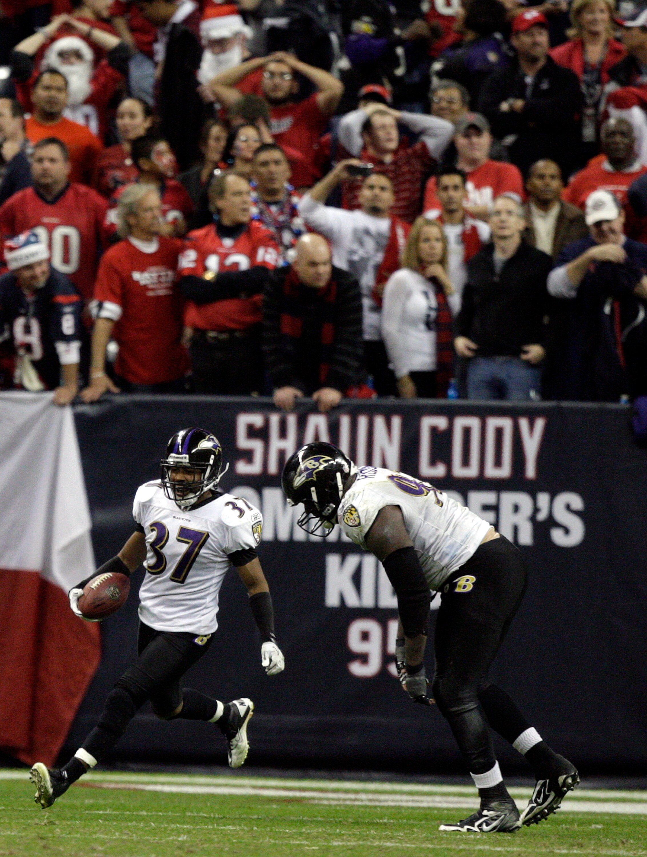 HOUSTON, TX - DECEMBER 13:  Cornerback Josh Wilson #37 of the Baltimore Ravens celebrates intercepting a pass from Matt Schaub of the Houston Texans in overtime at Reliant Stadium on December 13, 2010 in Houston, Texas.  (Photo by Bob Levey/Getty Images)