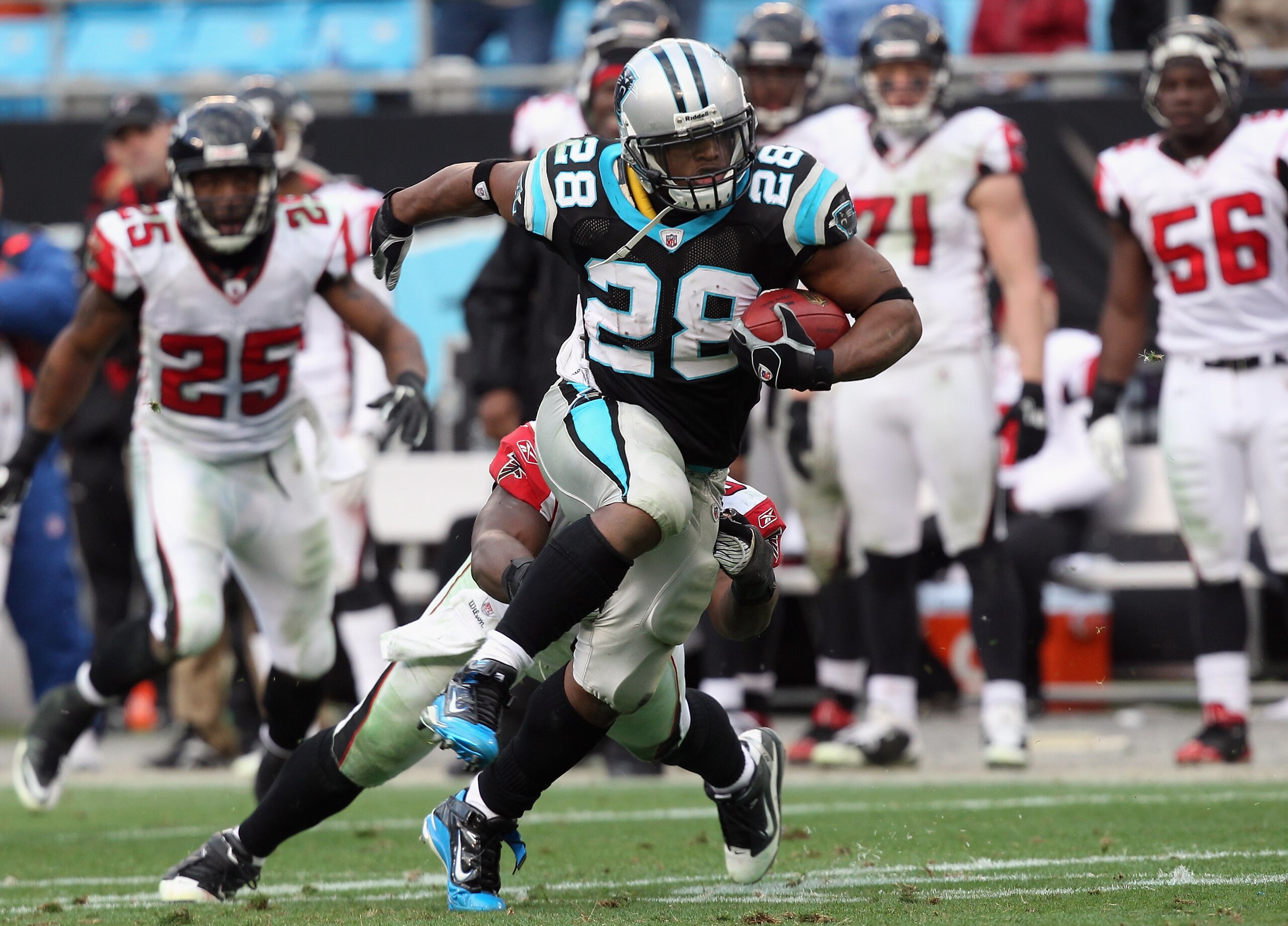 CHARLOTTE, NC - DECEMBER 12:  Jonathan Stewart #28 of the Carolina Panthers runs with the ball against the Atlanta Falcons during their game at Bank of America Stadium on December 12, 2010 in Charlotte, North Carolina.  (Photo by Streeter Lecka/Getty Imag
