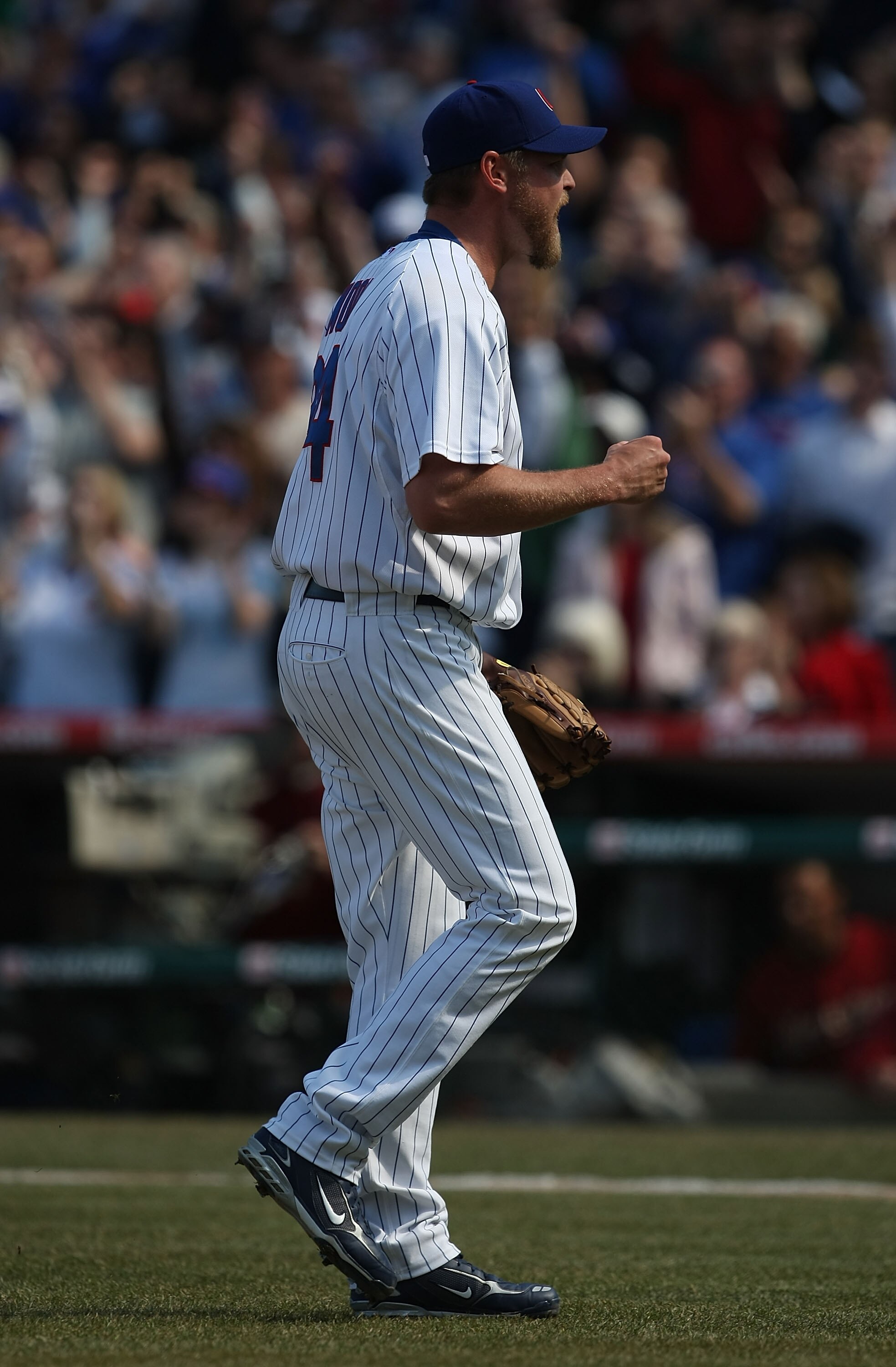 CHICAGO - APRIL 05: Closing pitcher Kerry Wood #34 of the Chicago Cubs celebrates a win against the Houston Astros after picking up his second save of the season on April 5, 2008 at Wrigley Field in Chicago, Illinois. The Cubs defeated the Astros 9-7.  (P