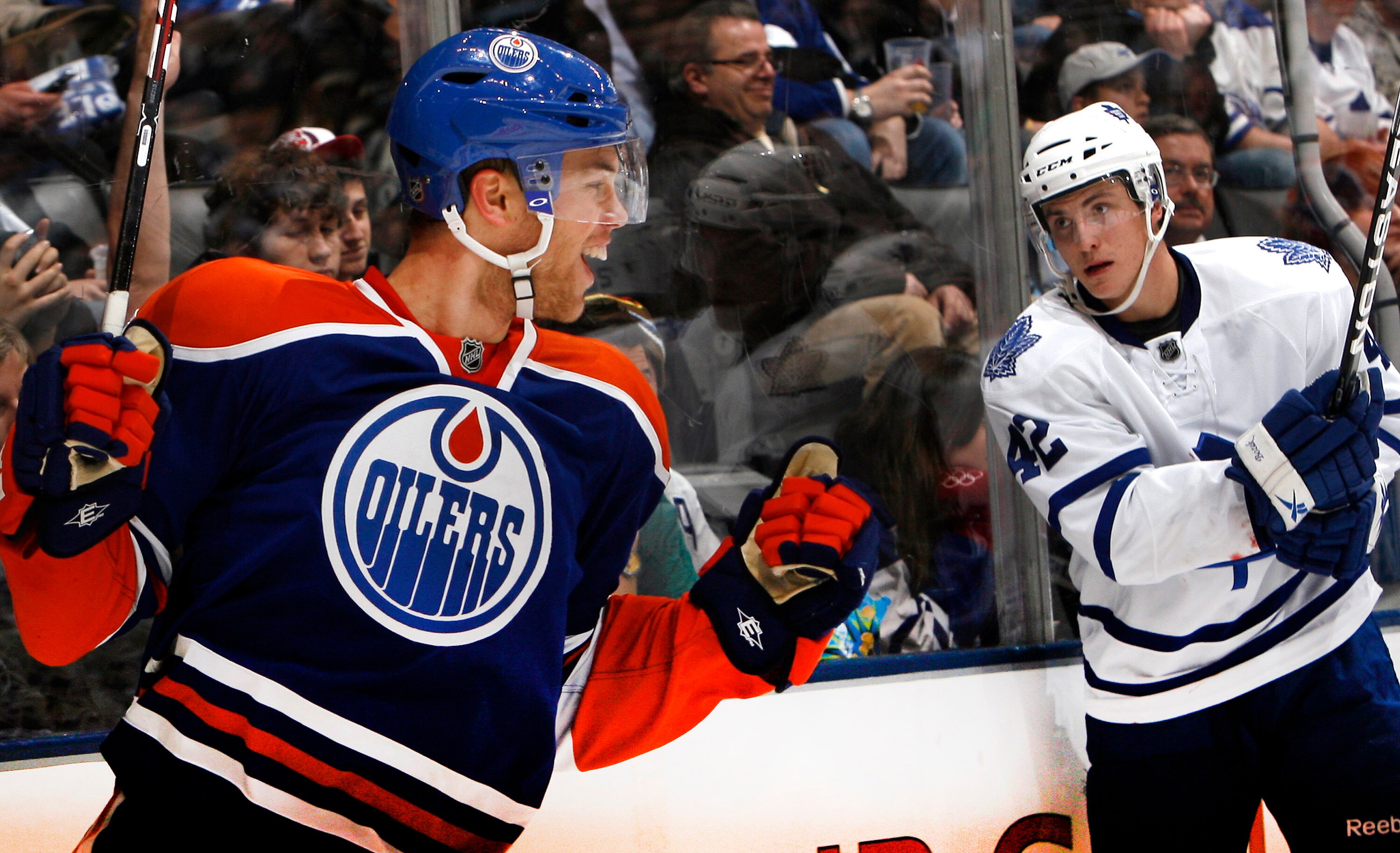 TORONTO, CANADA - DECEMBER 2:Tyler Bozak #42 of the Toronto Maple Leafs watches as Taylor Hall #4 of the Edmonton Oilers celebrates his goal during game action at the Air Canada Centre December 2, 2010 in Toronto, Ontario, Canada. (Photo by Abelimages / G