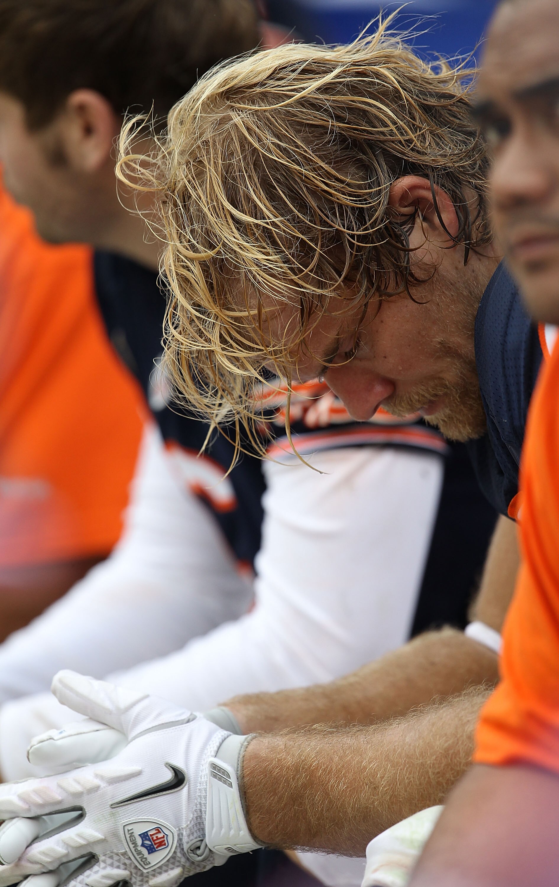 CHICAGO - OCTOBER 24: Greg Olsen #82 of the Chicago Bears sits on the bench with teammates at the end of a game against the Washington Redskins at Soldier Field on October 24, 2010 in Chicago, Illinois. The Redskins defeated the Bears 17-14.  (Photo by Jo