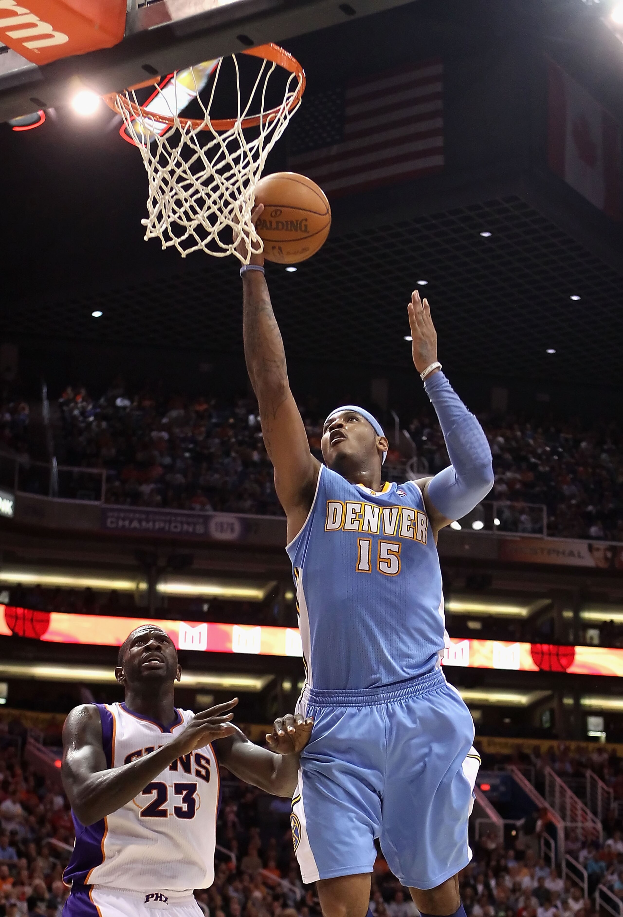 PHOENIX - NOVEMBER 15:  Carmelo Anthony #15 of the Denver Nuggets lays up a shot against the Phoenix Suns during the NBA game at US Airways Center on November 15, 2010 in Phoenix, Arizona.  The Suns defeated the Nuggets 100-94.  NOTE TO USER: User express