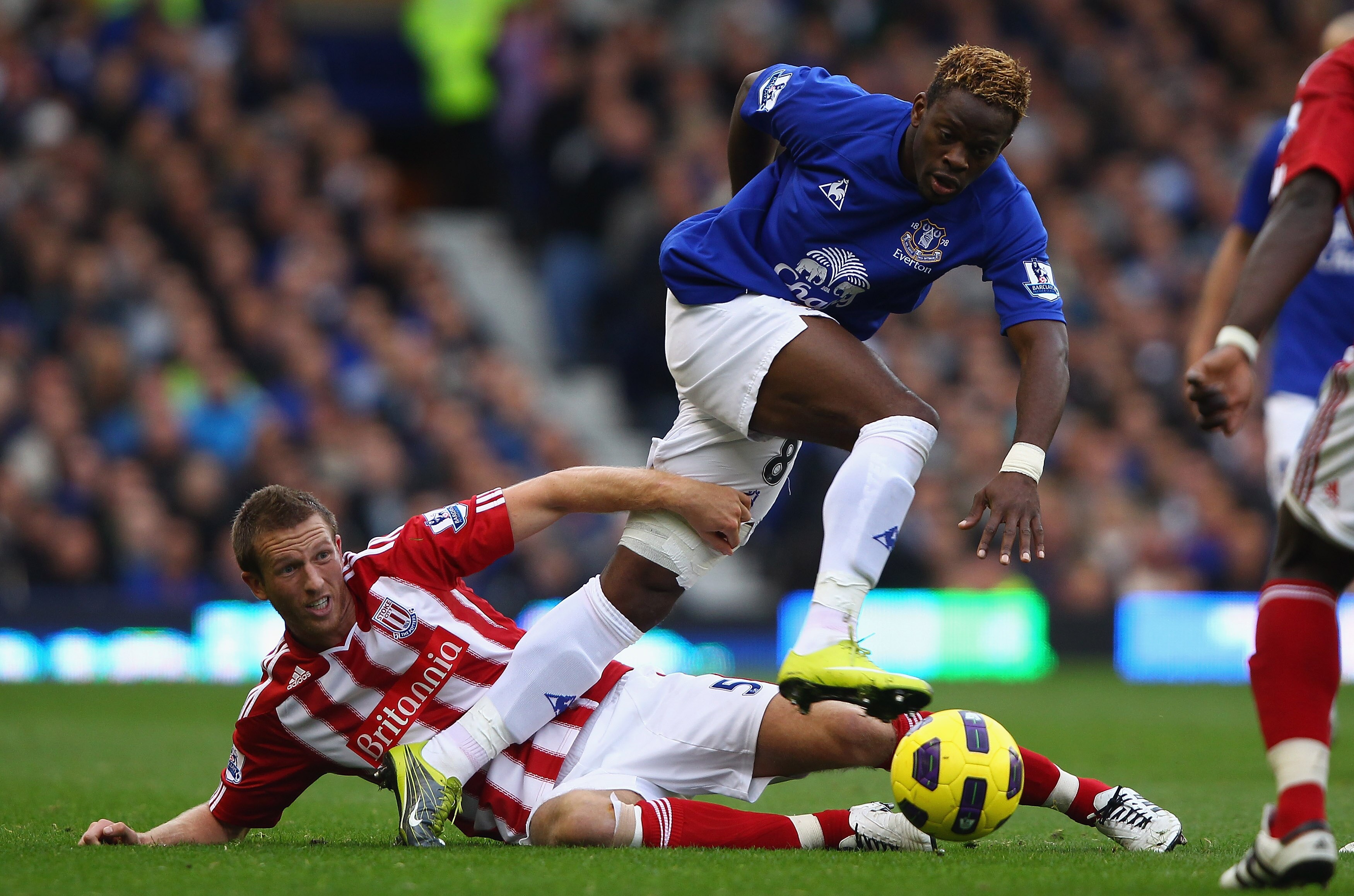 LIVERPOOL, ENGLAND - OCTOBER 30: Louis Saha of Everton attempts to move past a challenge from Danny Collins of Stoke City during the Barclays Premier League match between Everton and Stoke City at Goodison Park on October 30, 2010 in Liverpool, England.