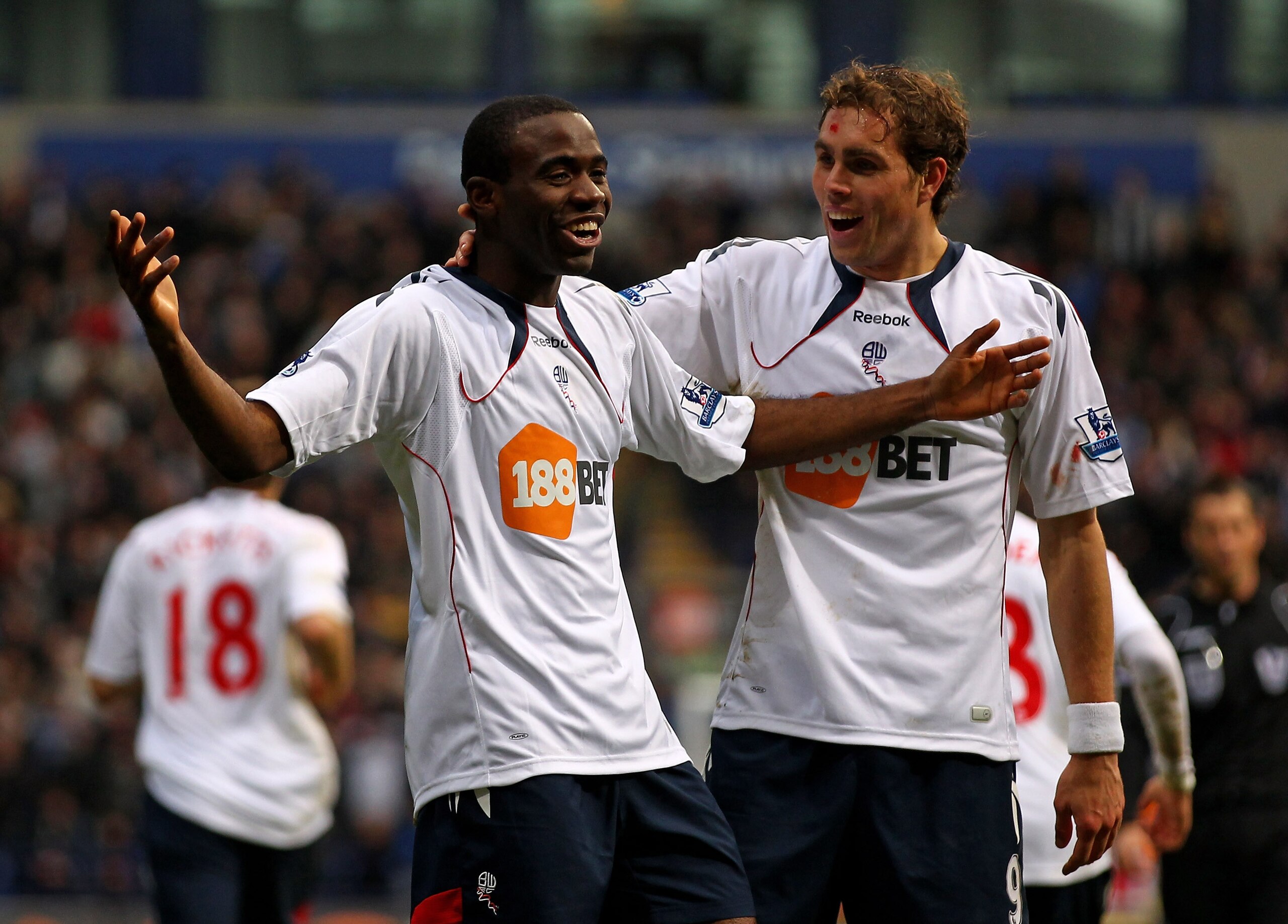 BOLTON, ENGLAND - DECEMBER 12:  Fabrice Muamba of Bolton Wanderers celebrates scoring the opening goal with his team mate Johan Elmander (R) during the Barclays Premier League match between Bolton Wanderers and Blackburn Rovers at the Reebok Stadium on De