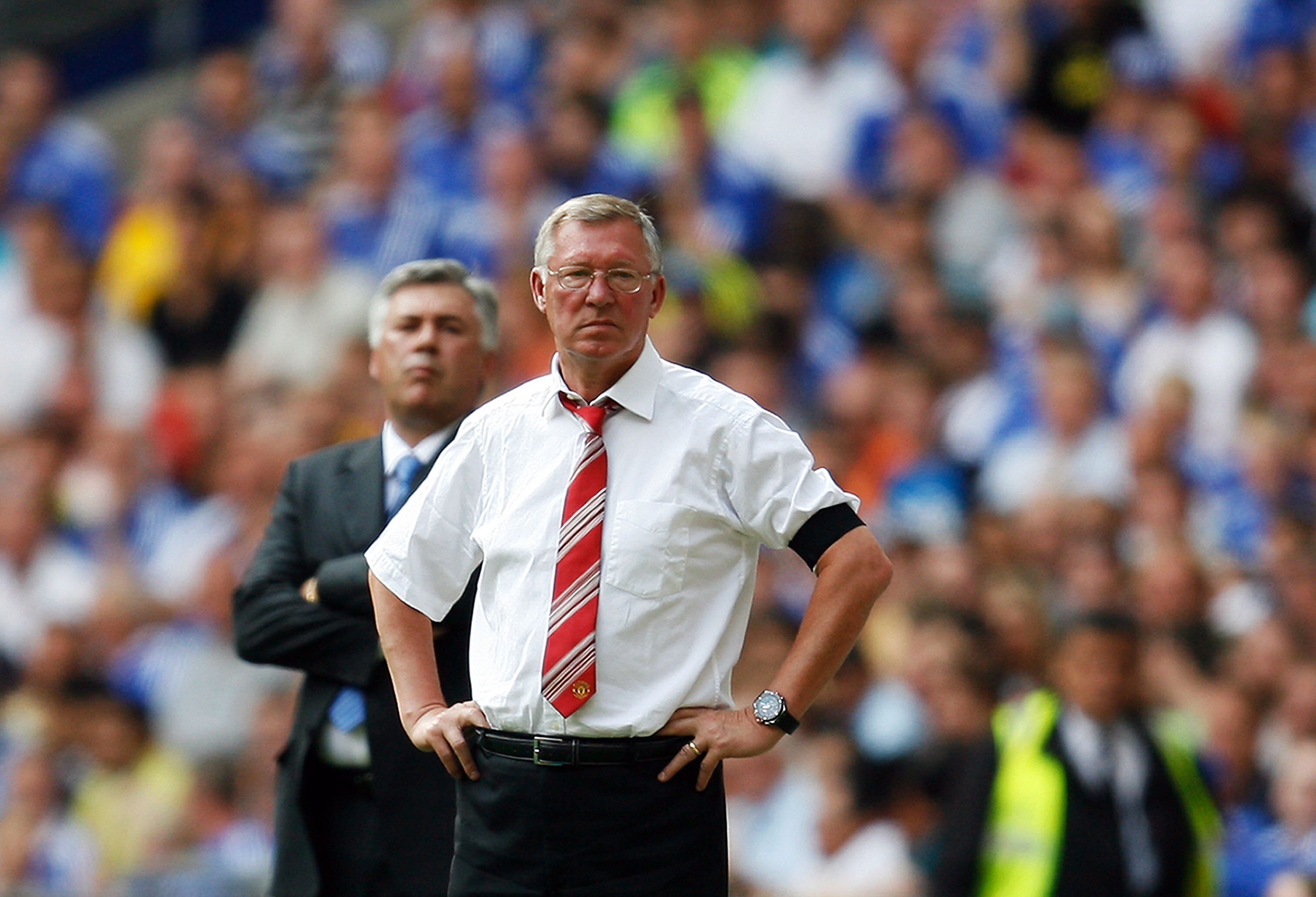 LONDON, ENGLAND - AUGUST 09:  Sir Alex Ferguson manager of Manchester United and Carlo Ancelotti manager of Chelsea look on during the FA Community Shield match between Manchester United and Chelsea at Wembley Stadium on August 9, 2009 in London, England.