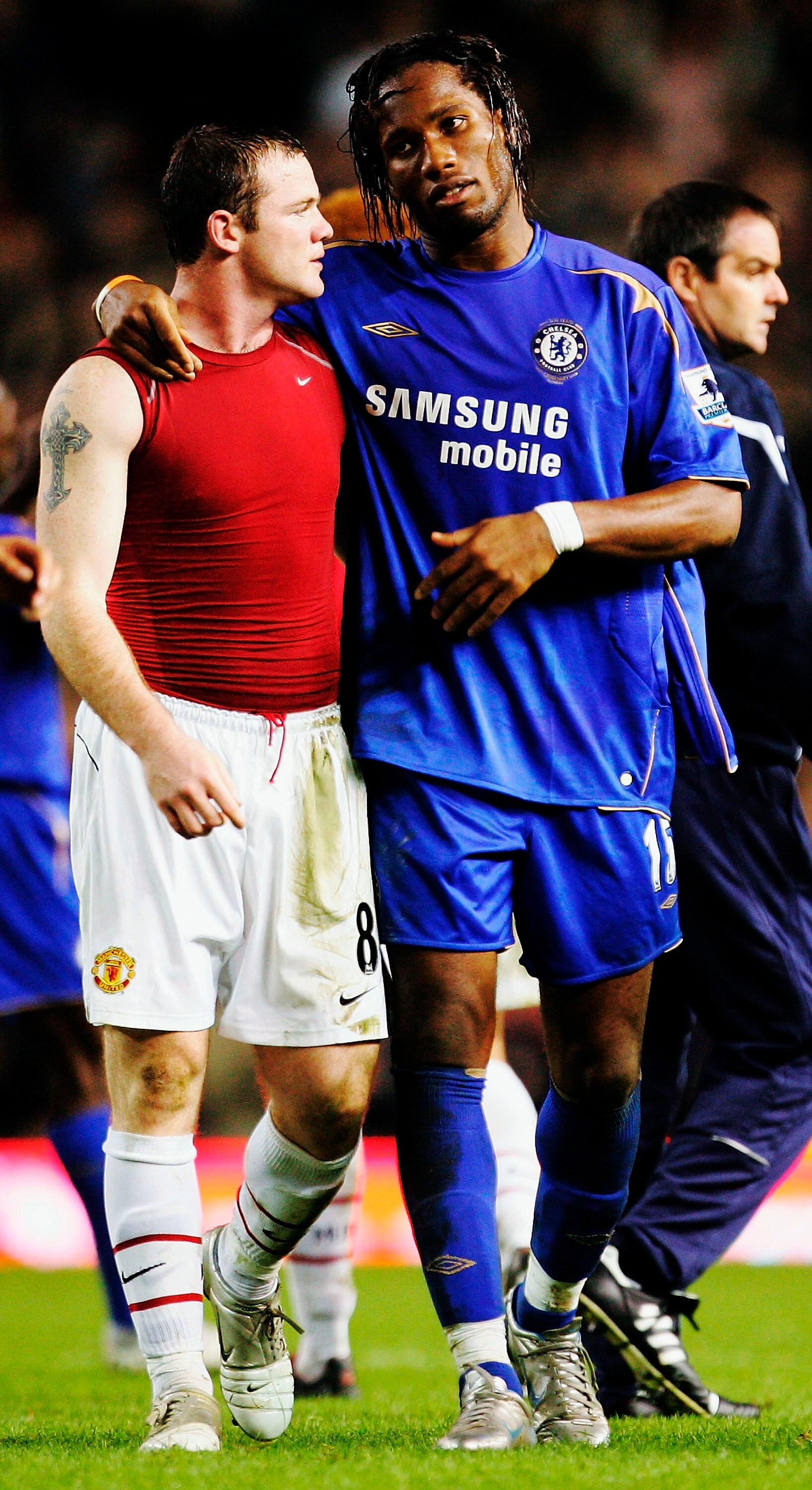 MANCHESTER, UNITED KINGDOM - NOVEMBER 06:  Didier Drogba (R) of Chelsea walks off with Wayne Rooney of Manchester United at the end of the Barclays Premiership match between Manchester United and Chelsea at Old Trafford on November 6, 2005 in Manchester,