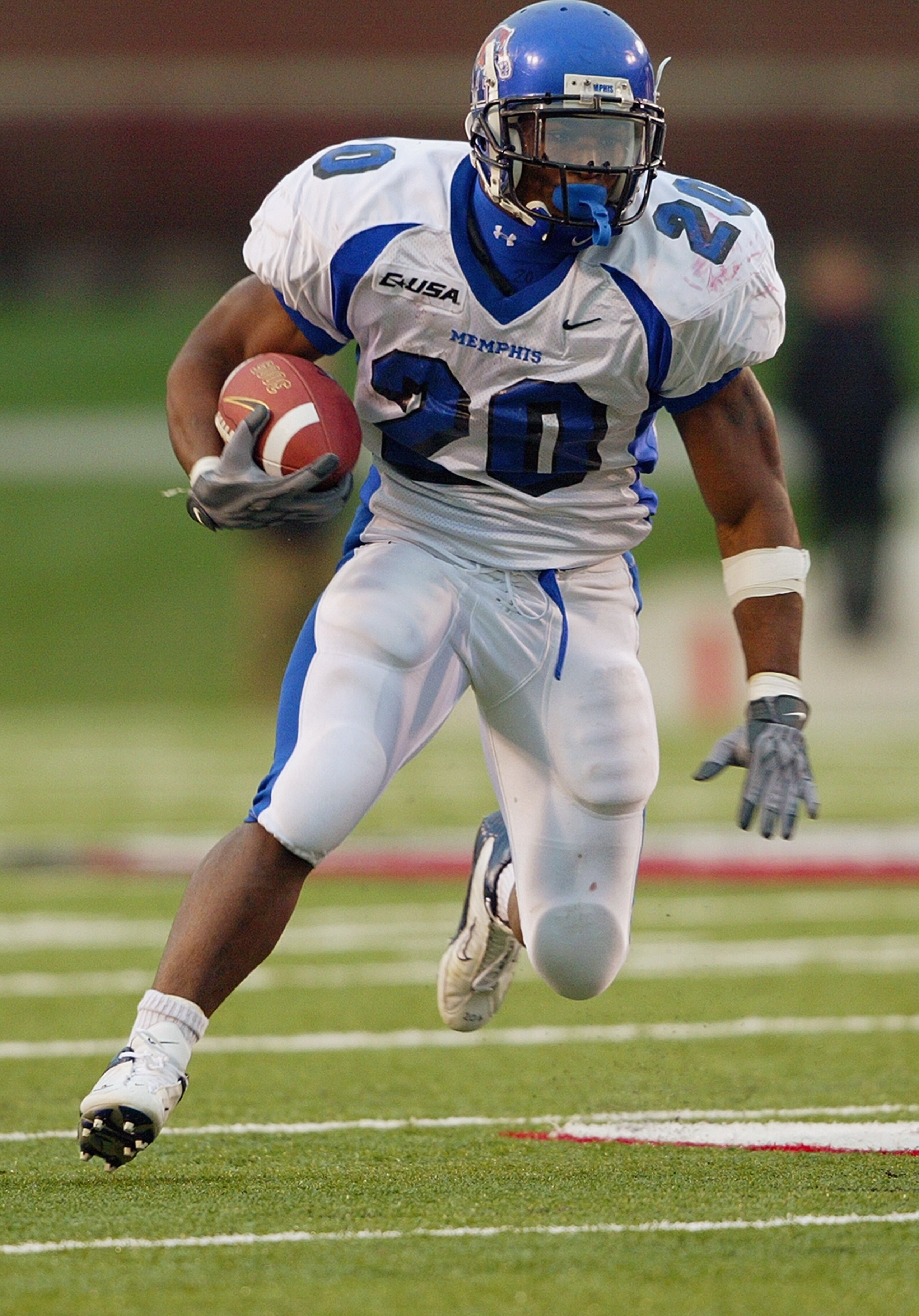 LOUISVILLE, KENTUCKY - NOVEMBER 15:  Running back DeAngelo Williams #20 of the Memphis Tigers runs with the ball during the game against the Louisville Cardinals on November15, 2003 at Papa John's Stadium in Louisville, Kentucky. The Tigers won 37-7. (Pho