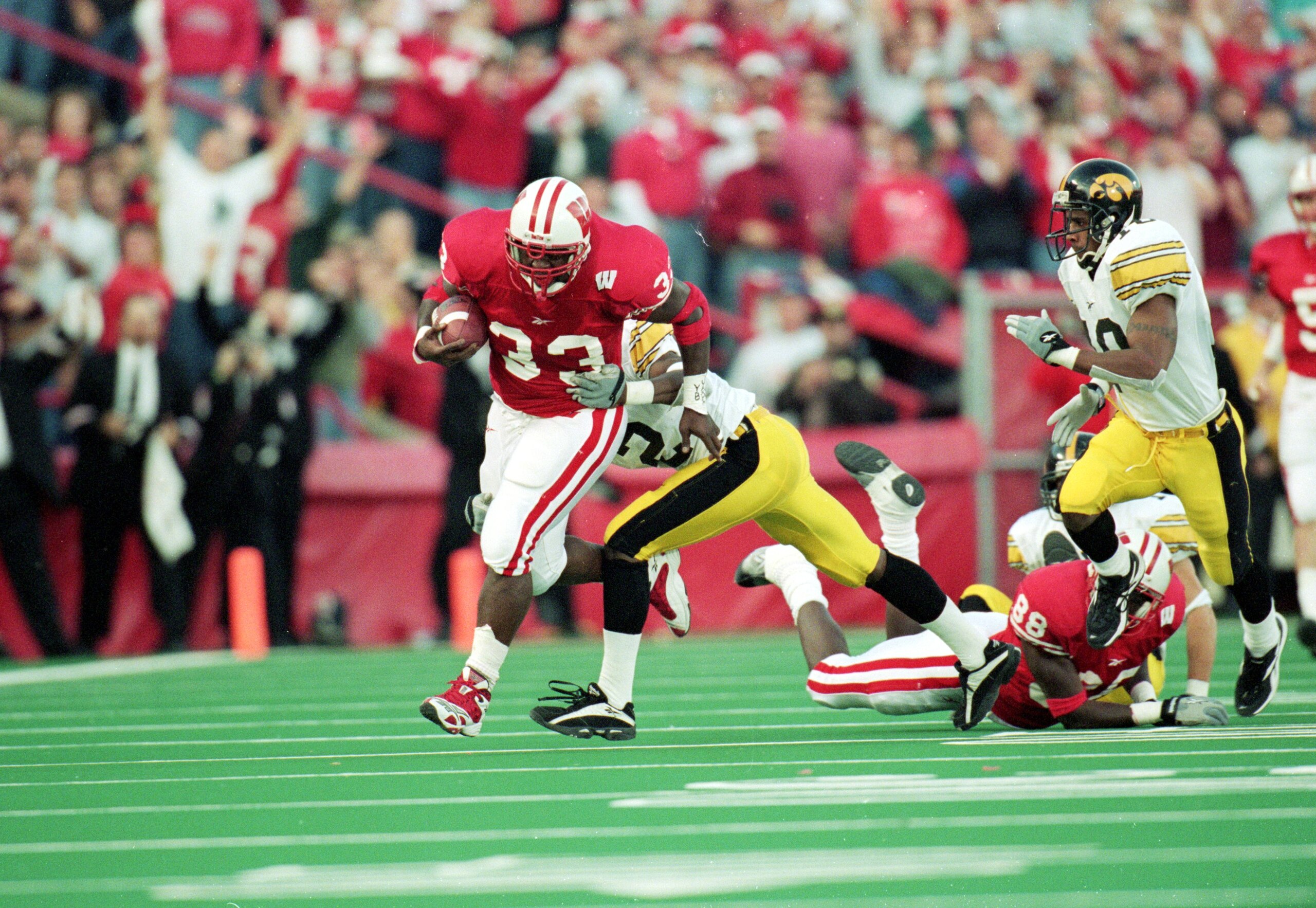 13 Nov 1999: Ron Dayne #33 of the Wisconsin Badgers carries the ball for a 32yard gain for a NCAA record during the game against the  Iowa Hawkeyes at the Camp Randall Stadium in Madison, Wisconsin. The Badgers defeated the Hawkeyes 41-3. Mandatory Credit