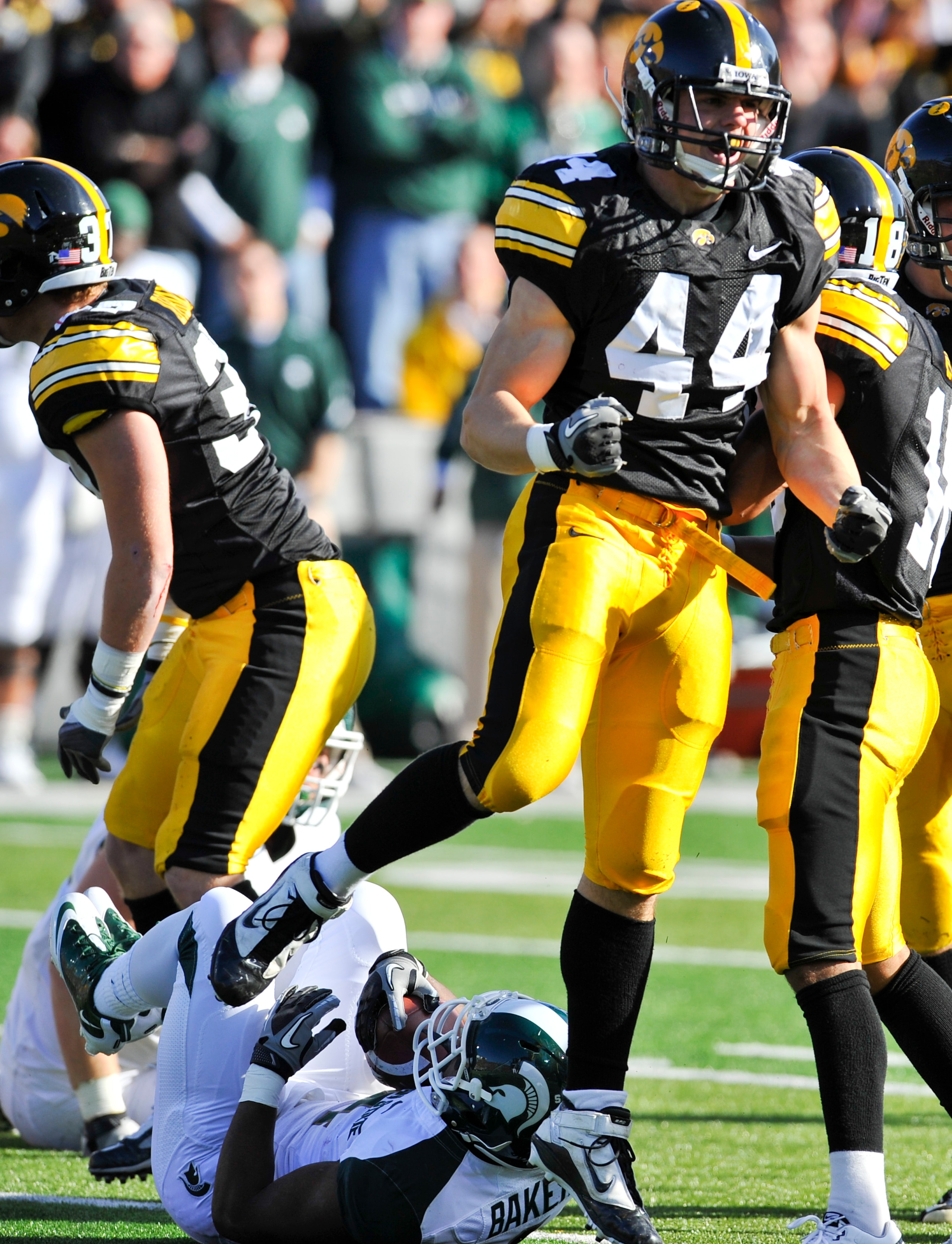 IOWA CITY, IA - OCTOBER 30:  Line backer James Morris #44 of the the University of Iowa Hawkeyes celebrates after tackling running back Edwin Baker #4 of the Michigan State Spartans during the first half of play at Kinnick Stadium on October 30, 2010 in I