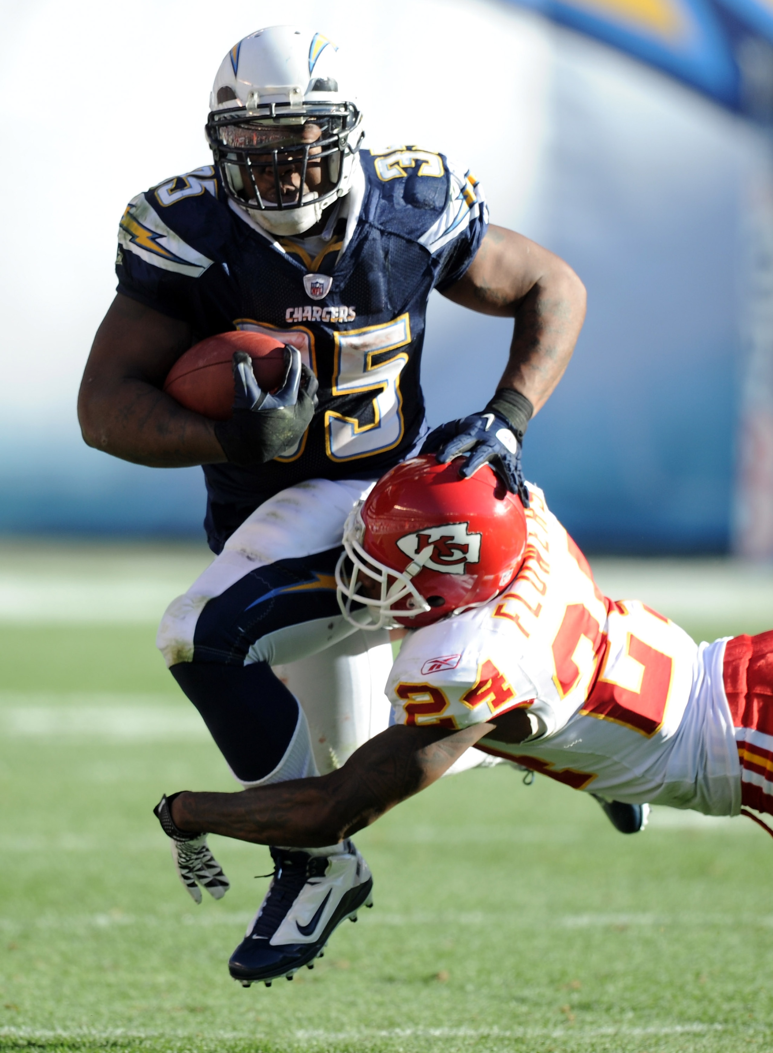 SAN DIEGO, CA - DECEMBER 12:  Mike Tolbert #35 of the San Diego Chargers carries the ball as he is tackled by Brandon Flowers #24 of the Kansas City Chiefs during the second quarter at Qualcomm Stadium on December 12, 2010 in San Diego, California.  (Phot