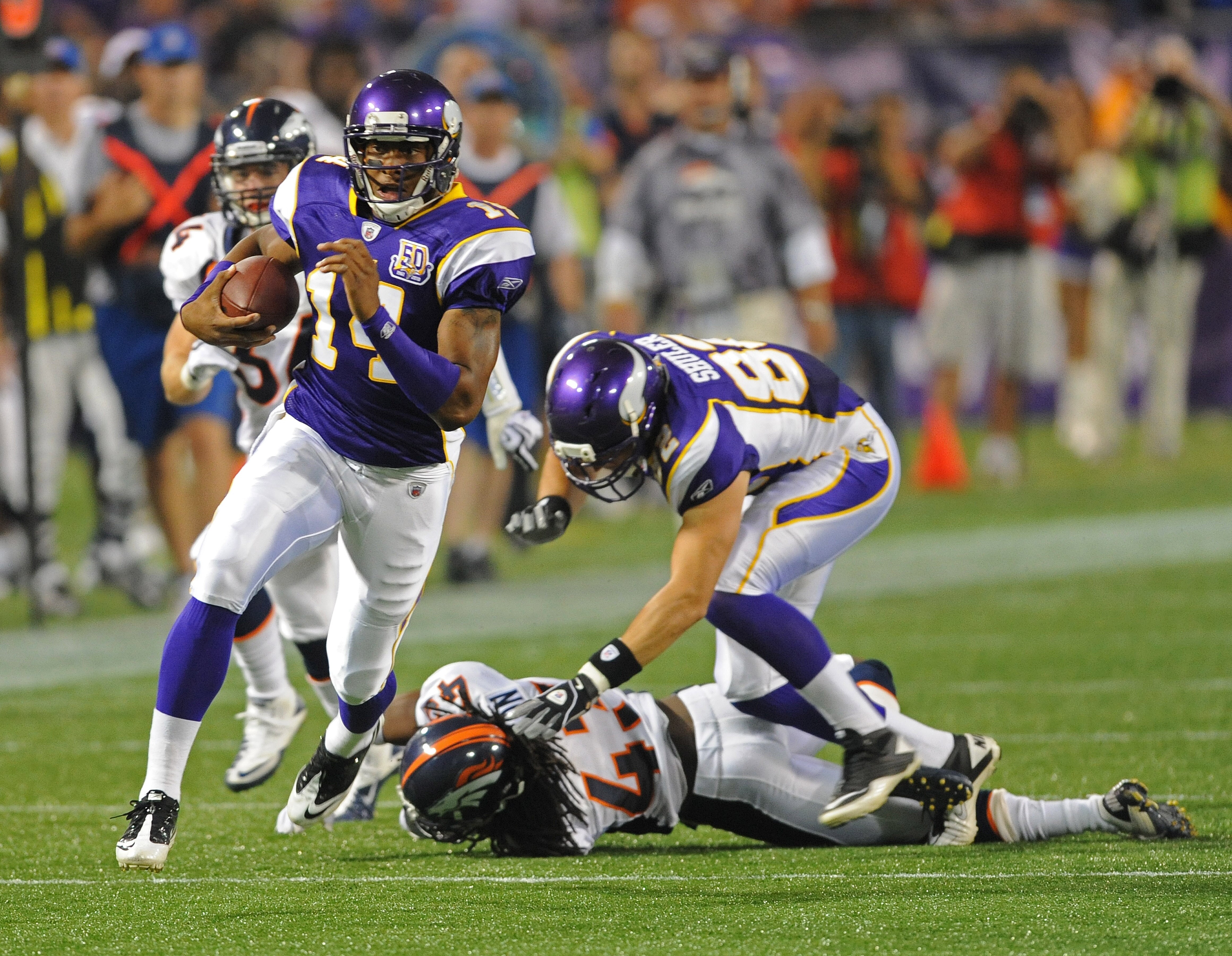 MINNEAPOLIS - SEPTEMBER 02:  Joe Webb #14 of the Minnesota Vikings carries the ball during an NFL preseason game against the Denver Broncos at the Mall of America Field at Hubert H. Humphrey Metrodome, on September 2, 2010 in Minneapolis, Minnesota.  (Pho