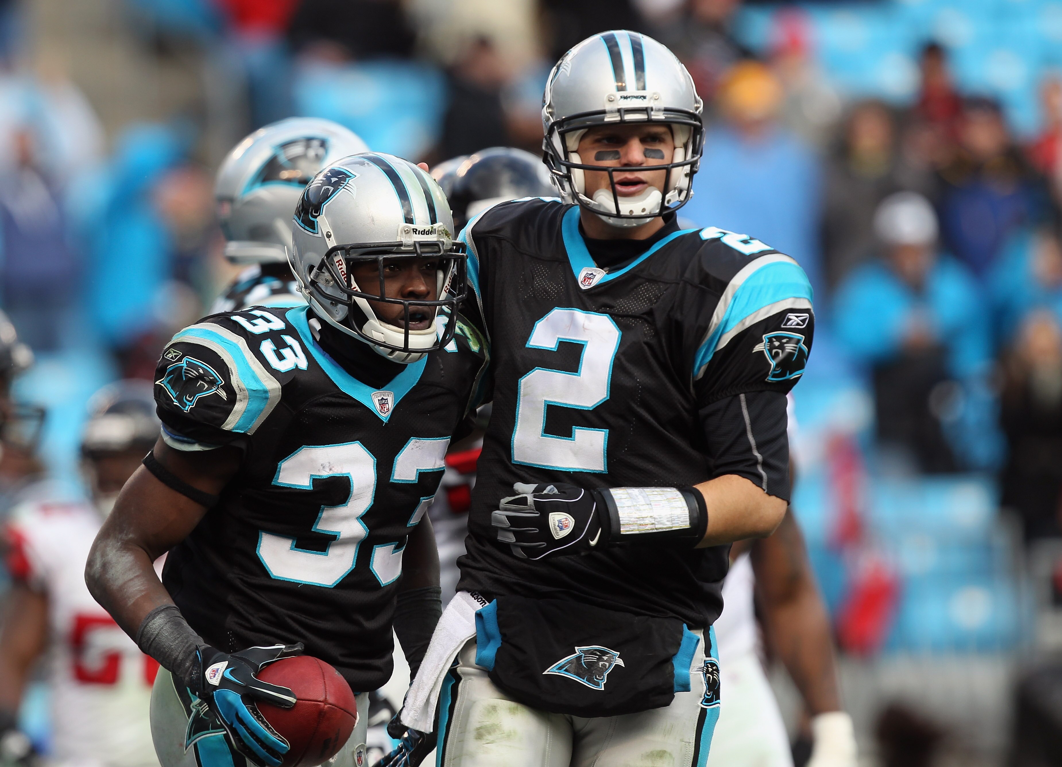 CHARLOTTE, NC - DECEMBER 12:  Teammates Casey Clausen #2 and Mike Goodson #33 of the Carolina Panthers during their game against the Atlanta Falcons at Bank of America Stadium on December 12, 2010 in Charlotte, North Carolina.  (Photo by Streeter Lecka/Ge