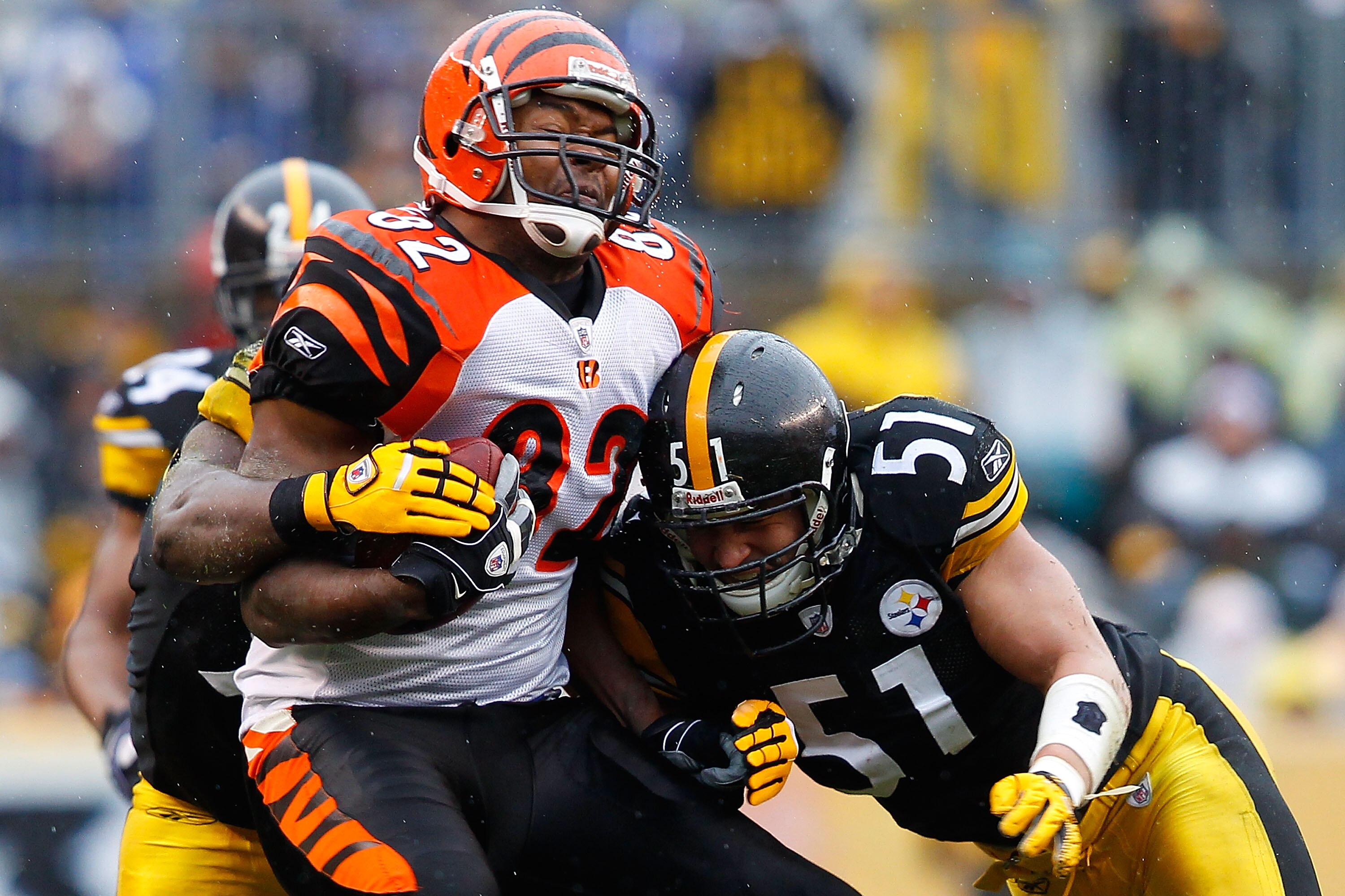 PITTSBURGH - DECEMBER 12: Reggie Kelly #82 of the Cincinnati Bengals is hit by James Farrior #51 of the Pittsburgh Steelers after catching a pass during the game on December 12, 2010 at Heinz Field in Pittsburgh, Pennsylvania. (Photo by Jared Wickerham/ PITTSBURGH - DECEMBER 12: Reggie Kelly #82 of the Cincinnati Bengals is hit by James Farrior #51 of the Pittsburgh Steelers after catching a pass during the game on December 12, 2010 at Heinz Field in Pittsburgh, Pennsylvania. (Photo by Jared Wickerham/