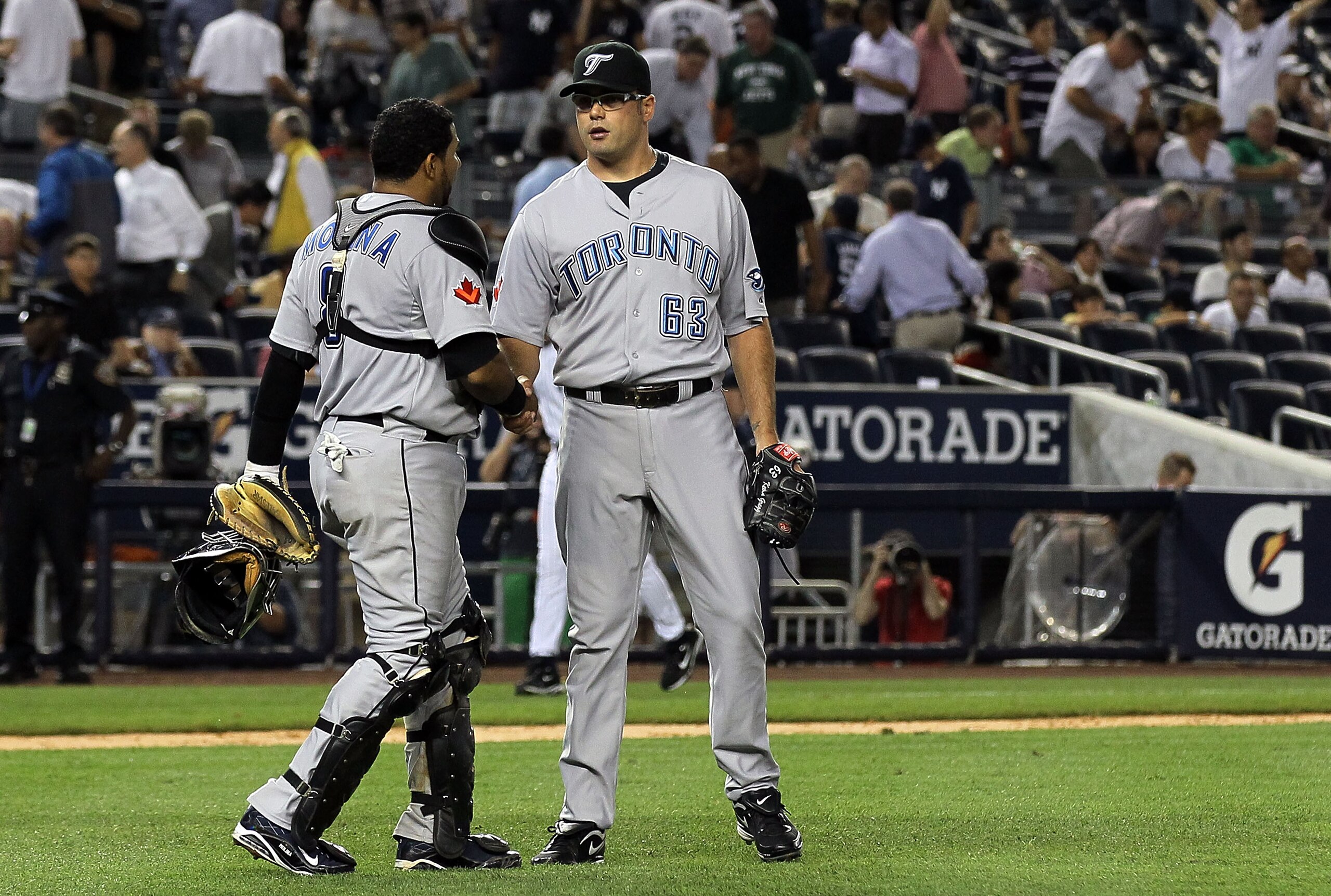 NEW YORK - AUGUST 02: Jose Molina #8 and Kevin Gregg #63 of the Toronto Blue Jays celebrate after defeating the New York Yankees on August 2, 2010 at Yankee Stadium in the Bronx borough of New York City. (Photo by Jim McIsaac/Getty Images) NEW YORK - AUGUST 02: Jose Molina #8 and Kevin Gregg #63 of the Toronto Blue Jays celebrate after defeating the New York Yankees on August 2, 2010 at Yankee Stadium in the Bronx borough of New York City. (Photo by Jim McIsaac/Getty Images)