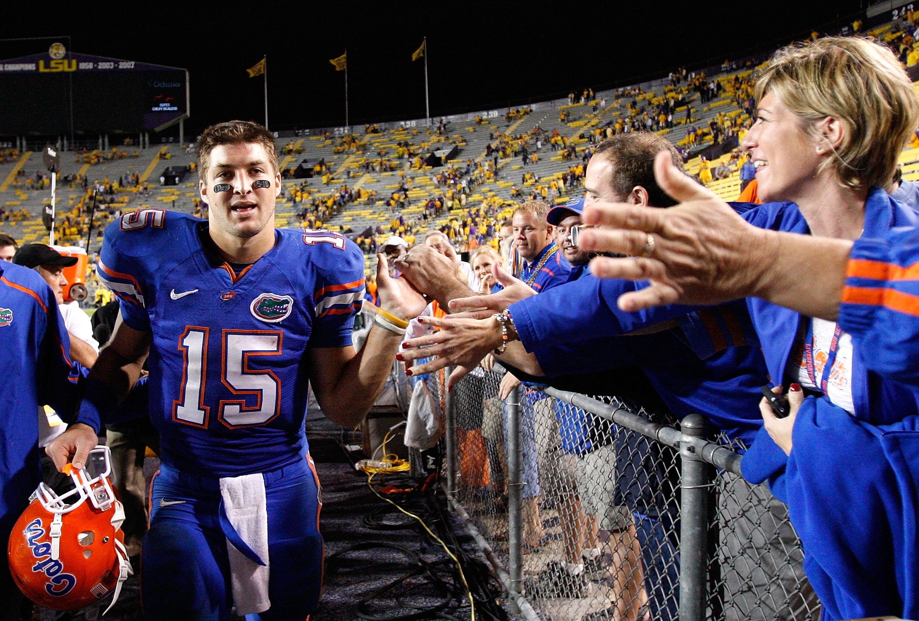 BATON ROUGE, LA - OCTOBER 10:  Quarterback Tim Tebow #15 of the Florida Gators celebrates their 13-3 win over the Louisiana State University Tigers with fans at Tiger Stadium on October 10, 2009 in Baton Rouge, Louisiana.  (Photo by Kevin C. Cox/Getty Ima