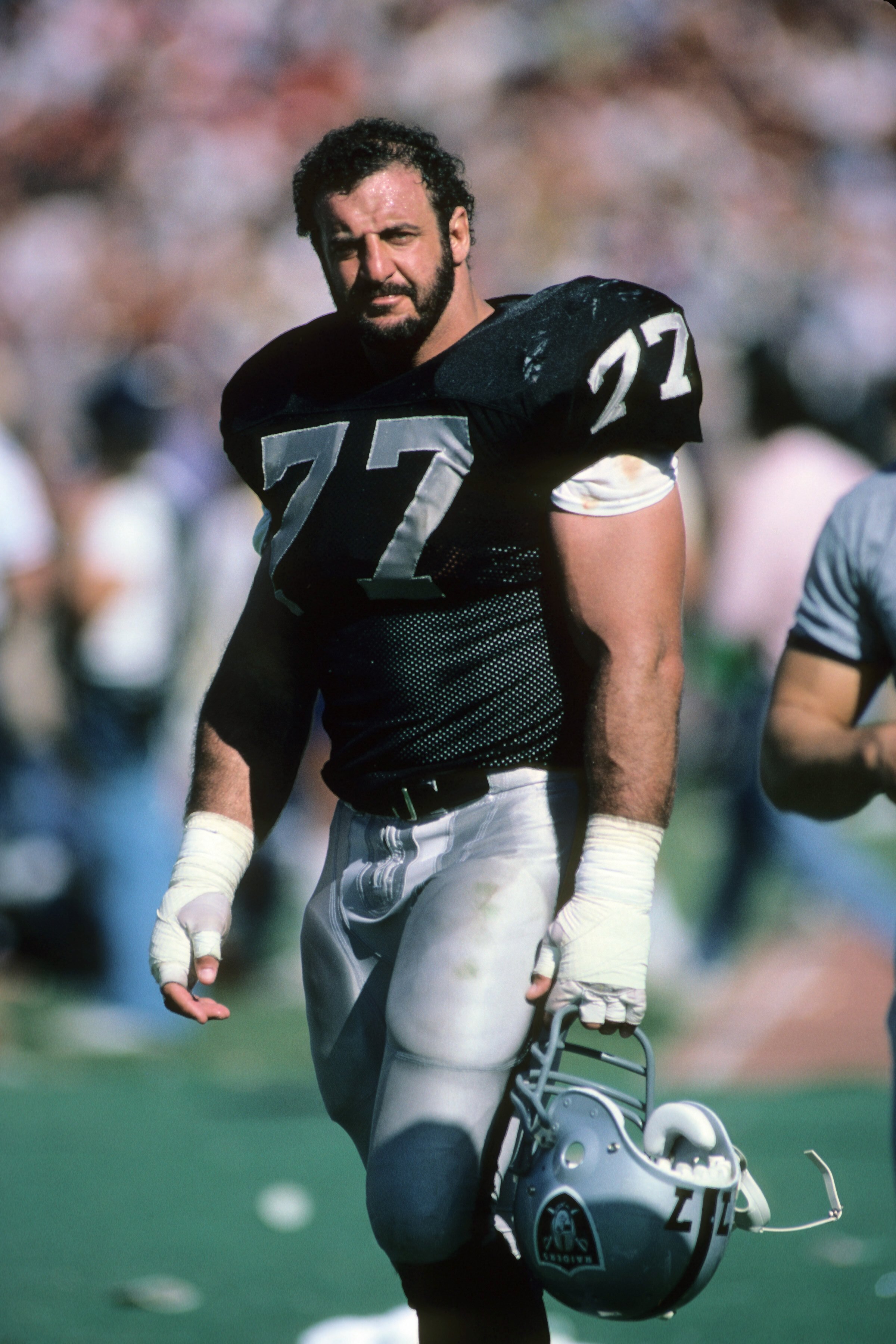 LOS ANGELES, CA - SEPTEMBER 22:  Lyle Alzado #77 of the Los Angeles Raiders stands on the field during the game against the San Francisco 49ers at the Los Angeles Memorial Coliseum on September 22, 1985 in Los Angeles, California.  The 49ers won 34-10. (P