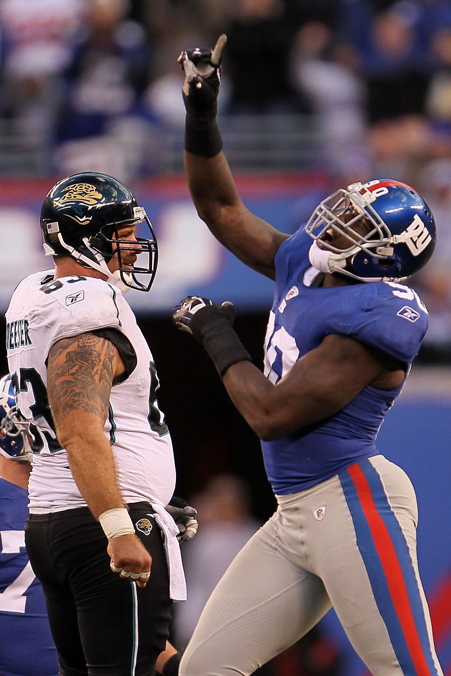 EAST RUTHERFORD, NJ - NOVEMBER 28: Jason Pierre-Paul #90 of the New York Giants celebrates after David Garrard #9 of the Jacksonville Jaguars was sacked at New Meadowlands Stadium on November 28, 2010 in East Rutherford, New Jersey.  (Photo by Chris McGra