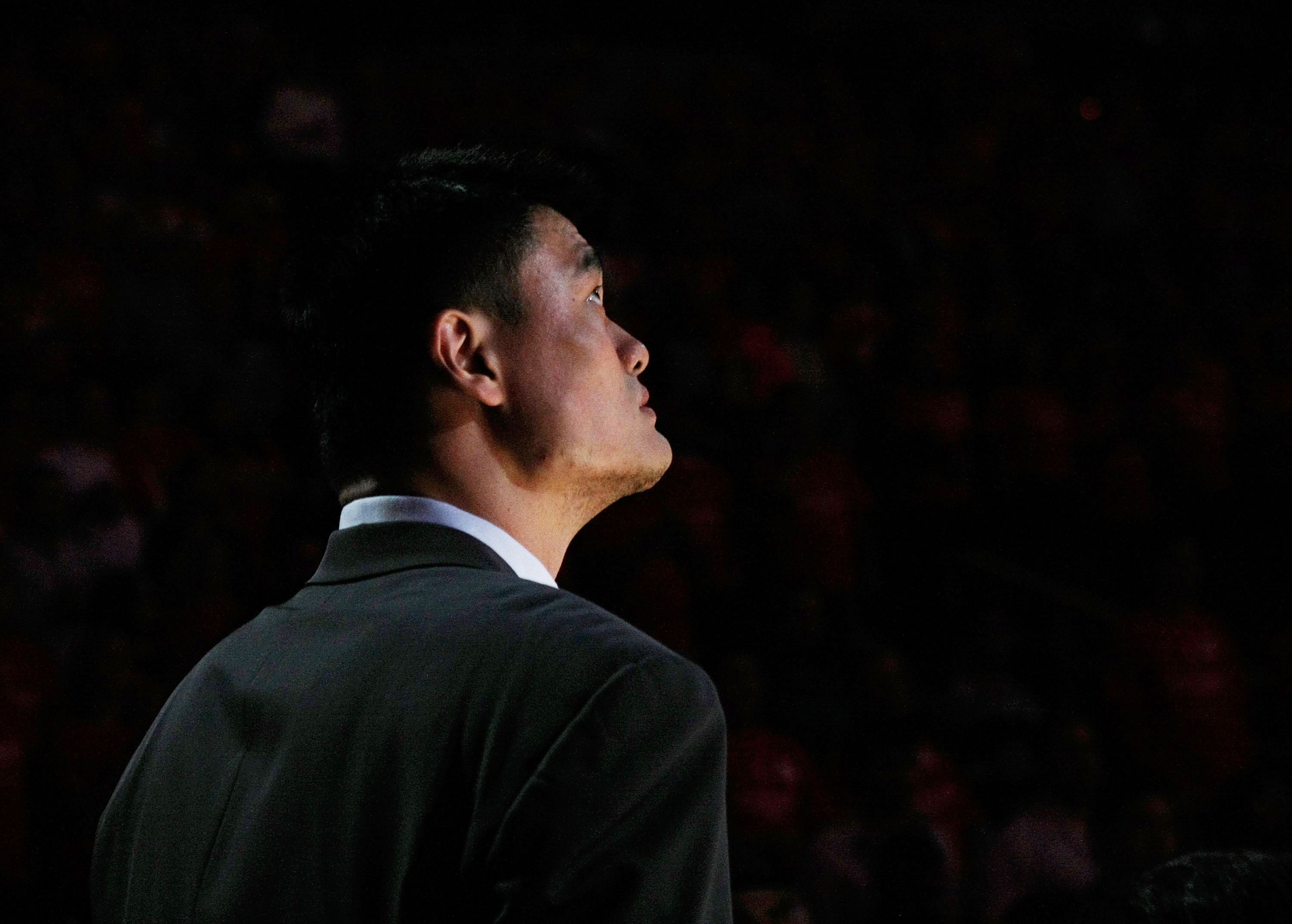 HOUSTON - APRIL 19:  Injured center Yao Ming #11 of the Houston Rockets watches pregame introductions for Game One of the Western Conference Quarterfinals against the Utah Jazz during the 2008 NBA Playoffs at the Toyota Center on April 19, 2008 in Houston