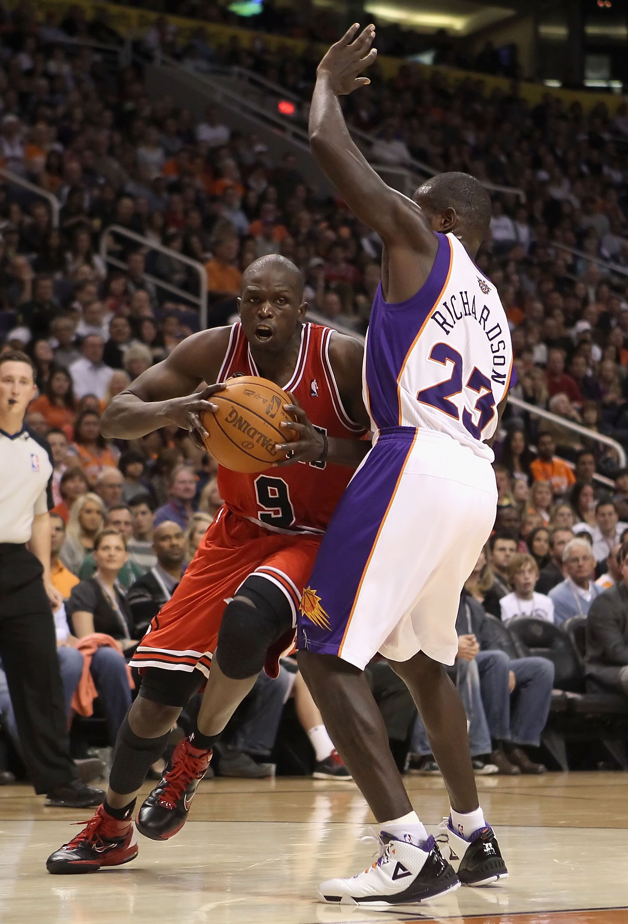 PHOENIX - NOVEMBER 24:  Luol Deng #9 of the Chicago Bulls drives to the basket during the NBA game against the Phoenix Suns at US Airways Center on November 24, 2010 in Phoenix, Arizona. The Bulls defeated the Suns 123-115 in double overtime.  NOTE TO USE