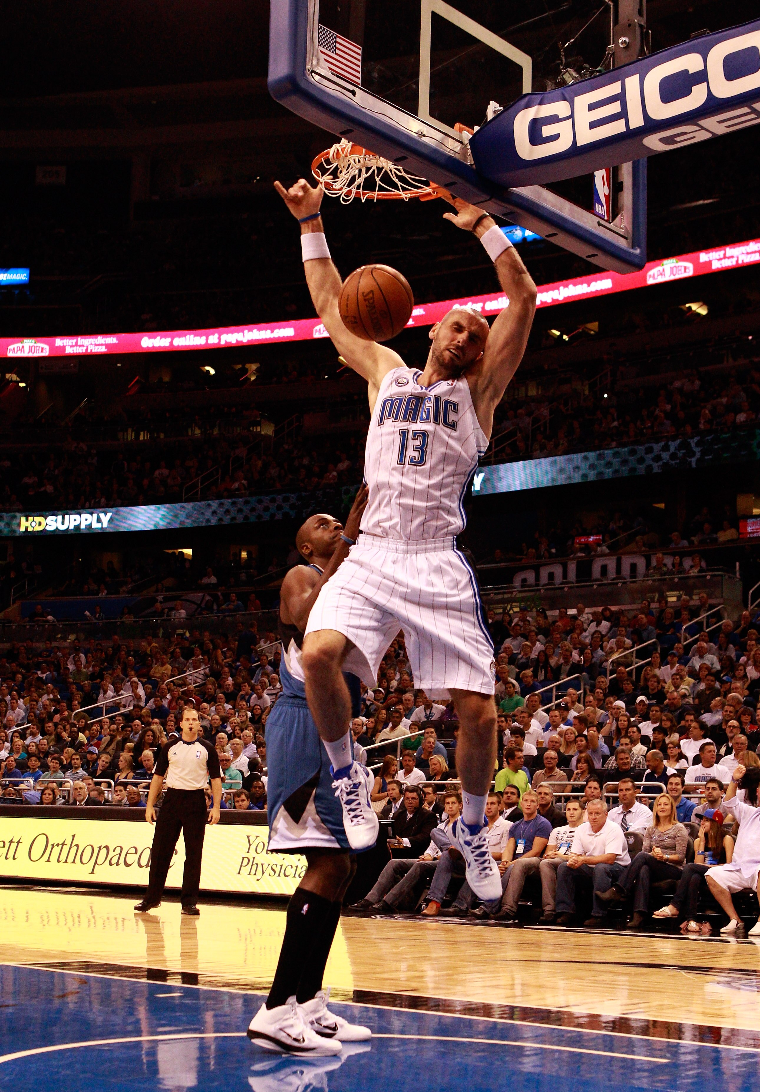 ORLANDO, FL - NOVEMBER 03:  Marcin Gortat #13 of the Orlando Magic dunks over Wesley Johnson #4 of the Minnesota Timberwolves during the game at Amway Arena on November 3, 2010 in Orlando, Florida.  NOTE TO USER: User expressly acknowledges and agrees tha