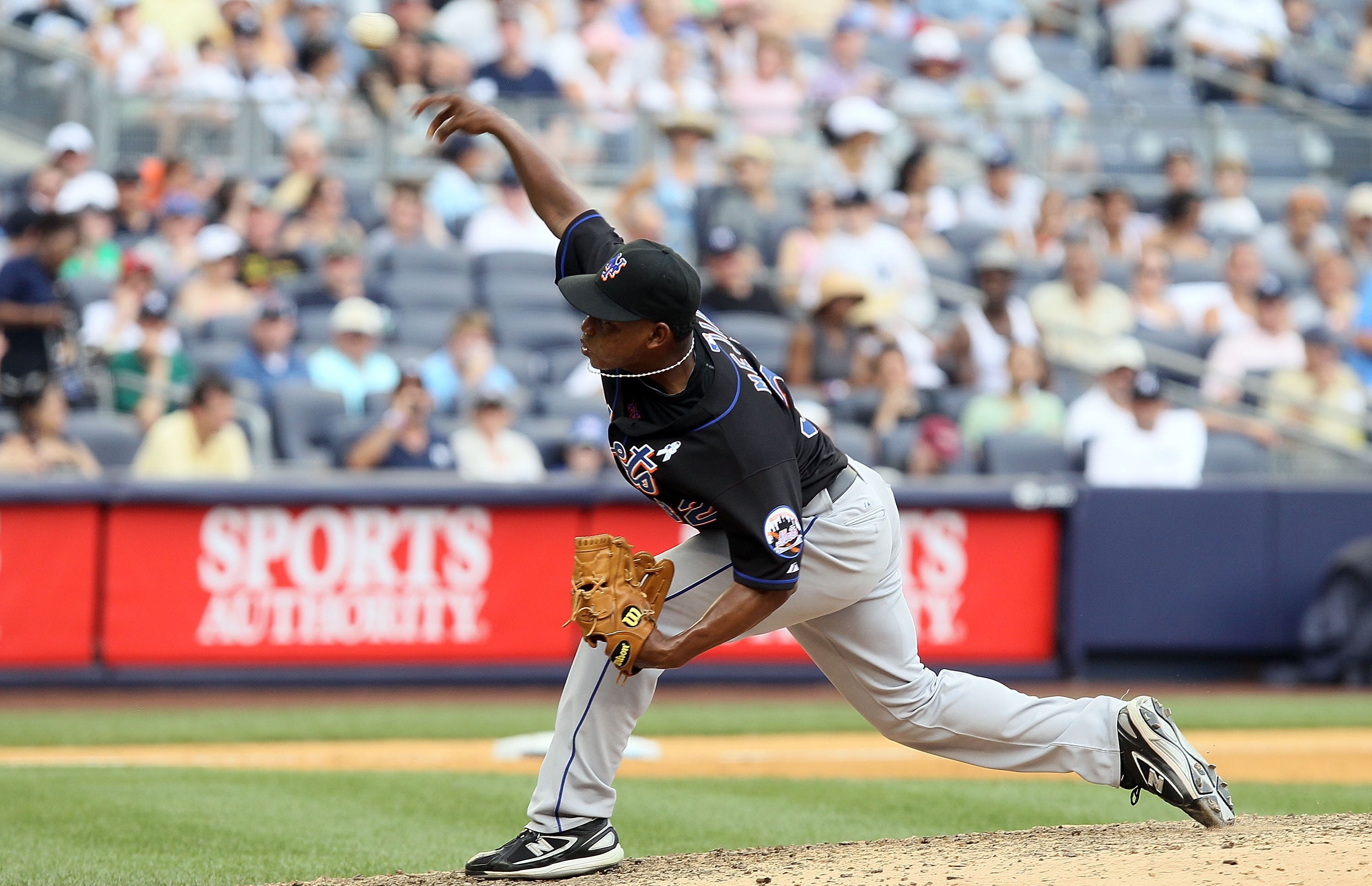 NEW YORK - JUNE 20:  Jenrry Mejia #32 of the New York Mets delivers a pitch against the New York Yankees on June 20, 2010 at Yankee Stadium in the Bronx borough of New York City.  (Photo by Jim McIsaac/Getty Images)