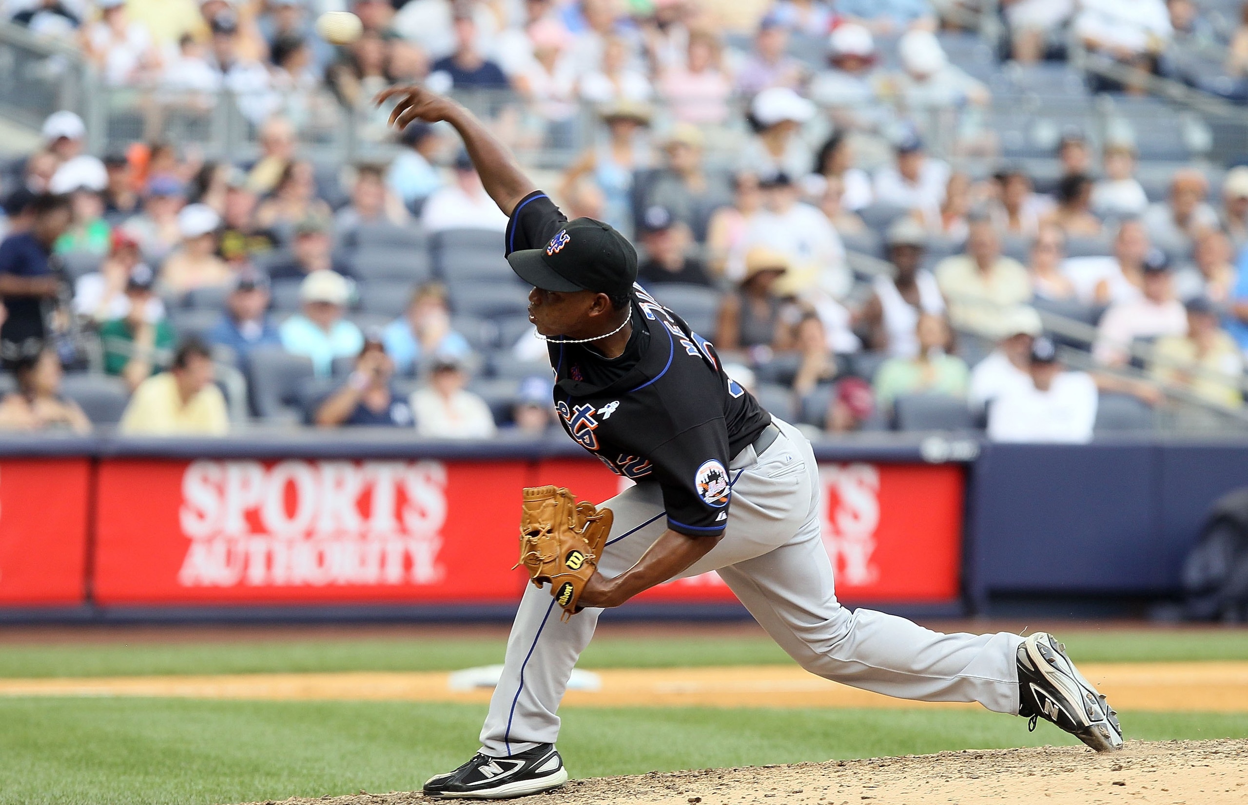 NEW YORK - JUNE 20:  Jenrry Mejia #32 of the New York Mets delivers a pitch against the New York Yankees on June 20, 2010 at Yankee Stadium in the Bronx borough of New York City.  (Photo by Jim McIsaac/Getty Images)