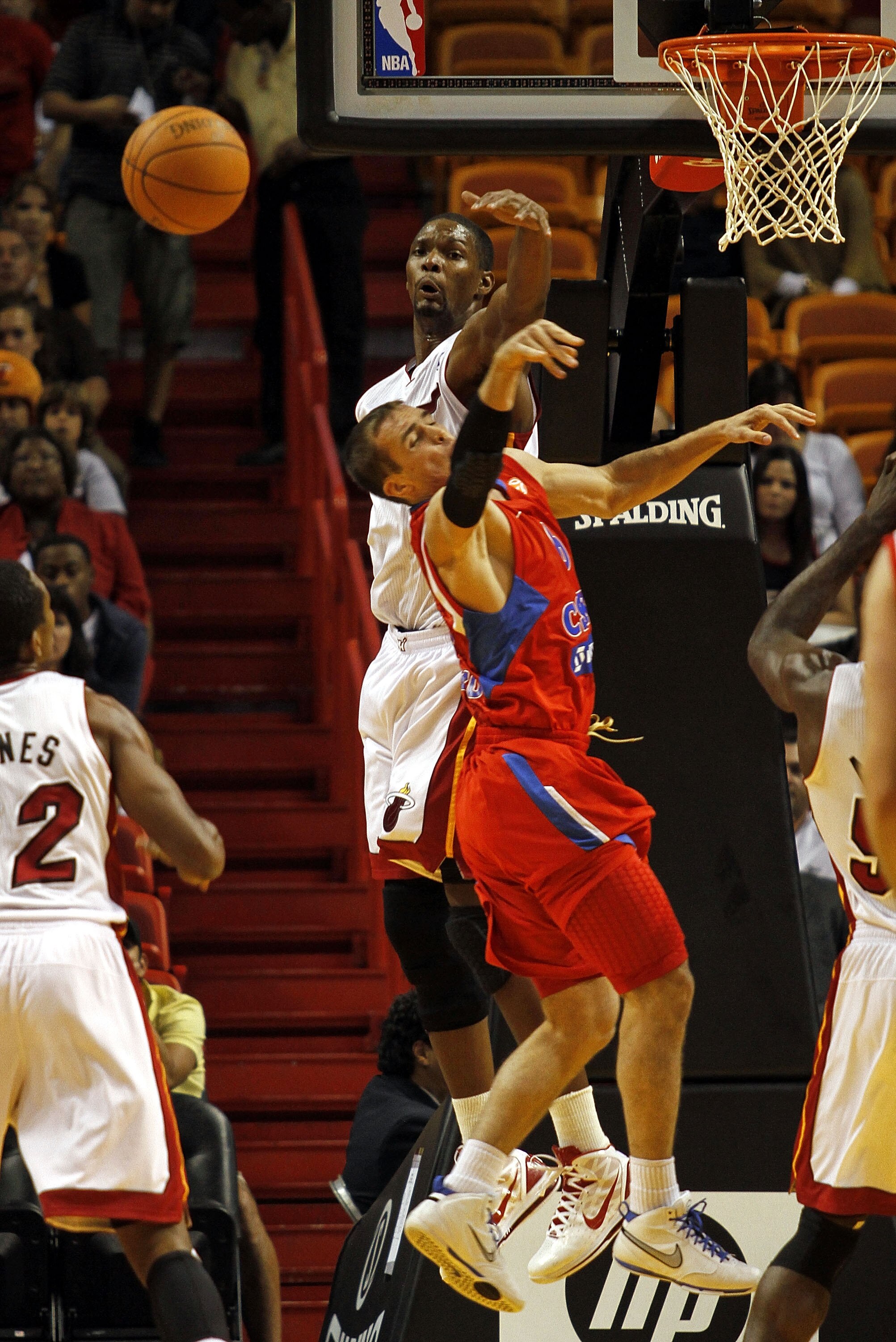 MIAMI - OCTOBER 12:  Forward Chris Bosh #1 of the Miami Heat defends against forward Matjaz Smodis #8 of CSKA Moskow on October 12, 2010 in Miami, Florida.  NOTE TO USER: User expressly acknowledges and agrees that, by downloading and or using this photog