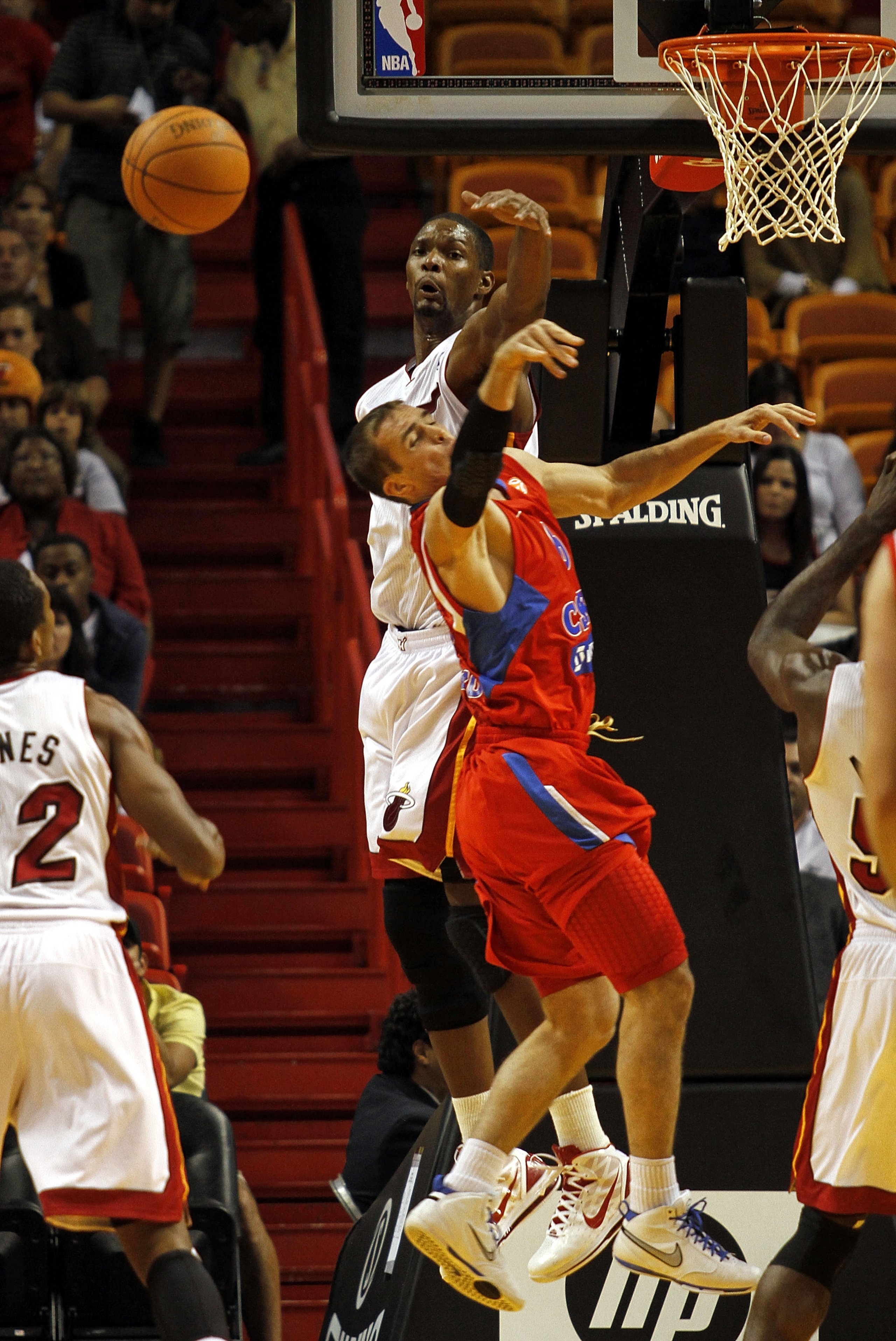 MIAMI - OCTOBER 12: Forward Chris Bosh #1 of the Miami Heat defends against forward Matjaz Smodis #8 of CSKA Moskow on October 12, 2010 in Miami, Florida. NOTE TO USER: User expressly acknowledges and agrees that, by downloading and or using this photog MIAMI - OCTOBER 12: Forward Chris Bosh #1 of the Miami Heat defends against forward Matjaz Smodis #8 of CSKA Moskow on October 12, 2010 in Miami, Florida. NOTE TO USER: User expressly acknowledges and agrees that, by downloading and or using this photog