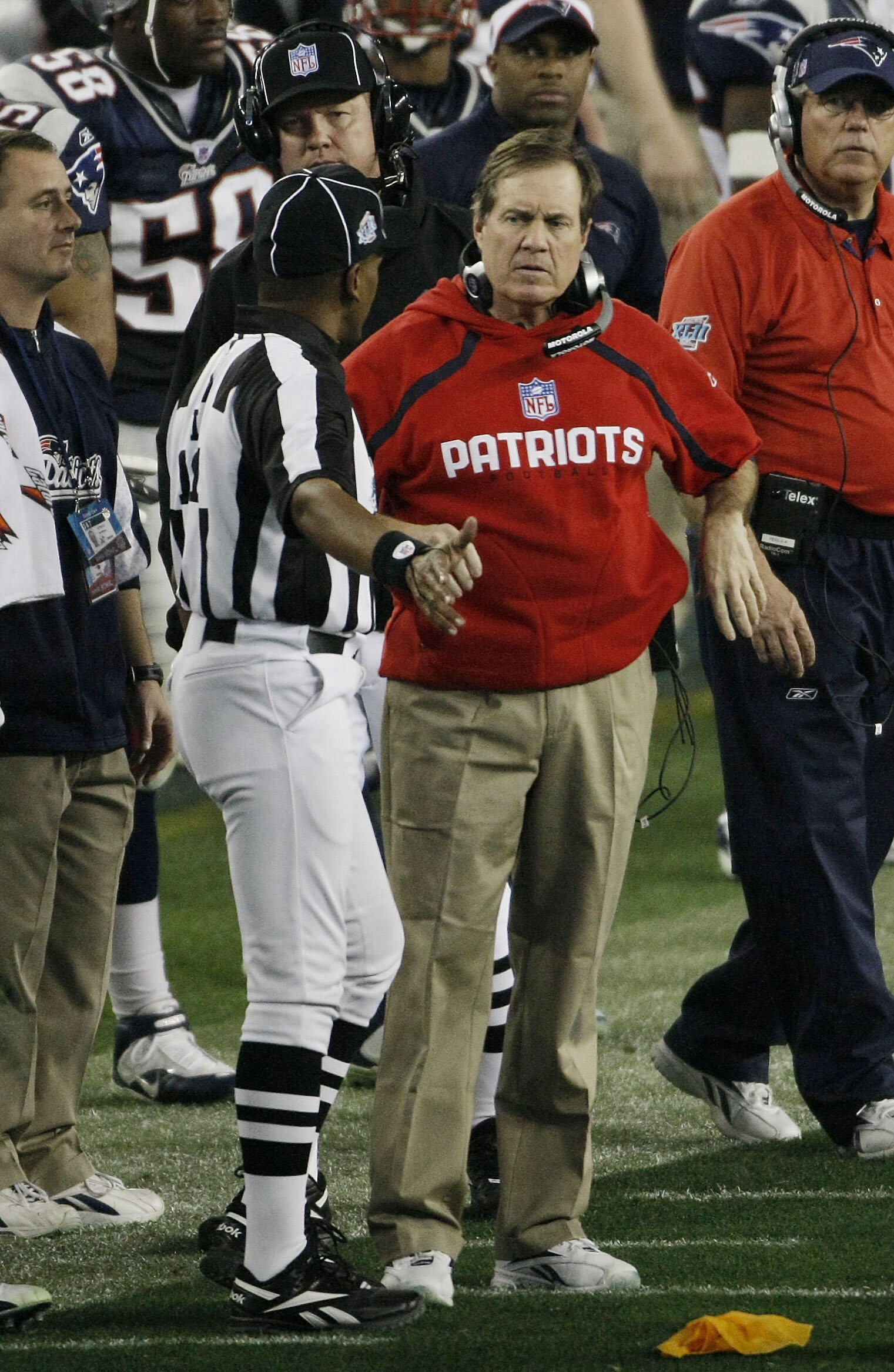 GLENDALE, AZ - FEBRUARY 03:  Head coach Bill Belichick of the New England Patriots talks with referee Mike Carey during Super Bowl XLII against the New York Giants on February 3, 2008 at the University of Phoenix Stadium in Glendale, Arizona.  (Photo by W