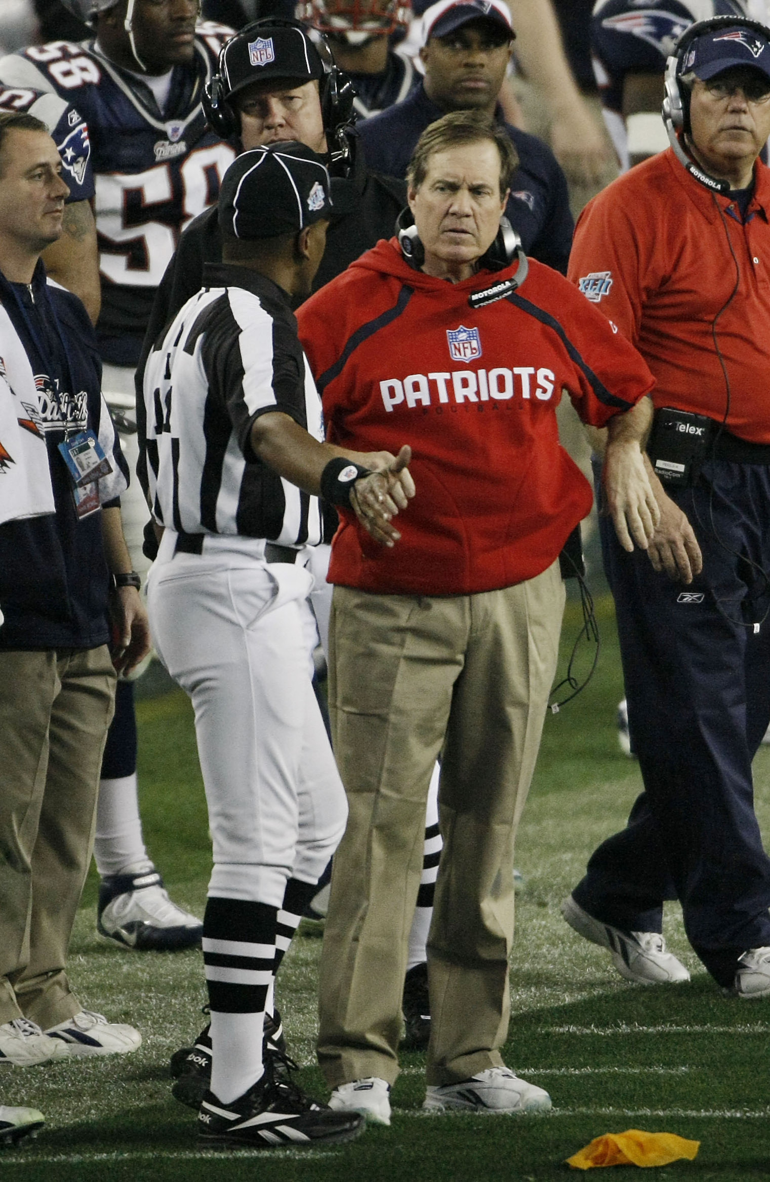 GLENDALE, AZ - FEBRUARY 03:  Head coach Bill Belichick of the New England Patriots talks with referee Mike Carey during Super Bowl XLII against the New York Giants on February 3, 2008 at the University of Phoenix Stadium in Glendale, Arizona.  (Photo by W