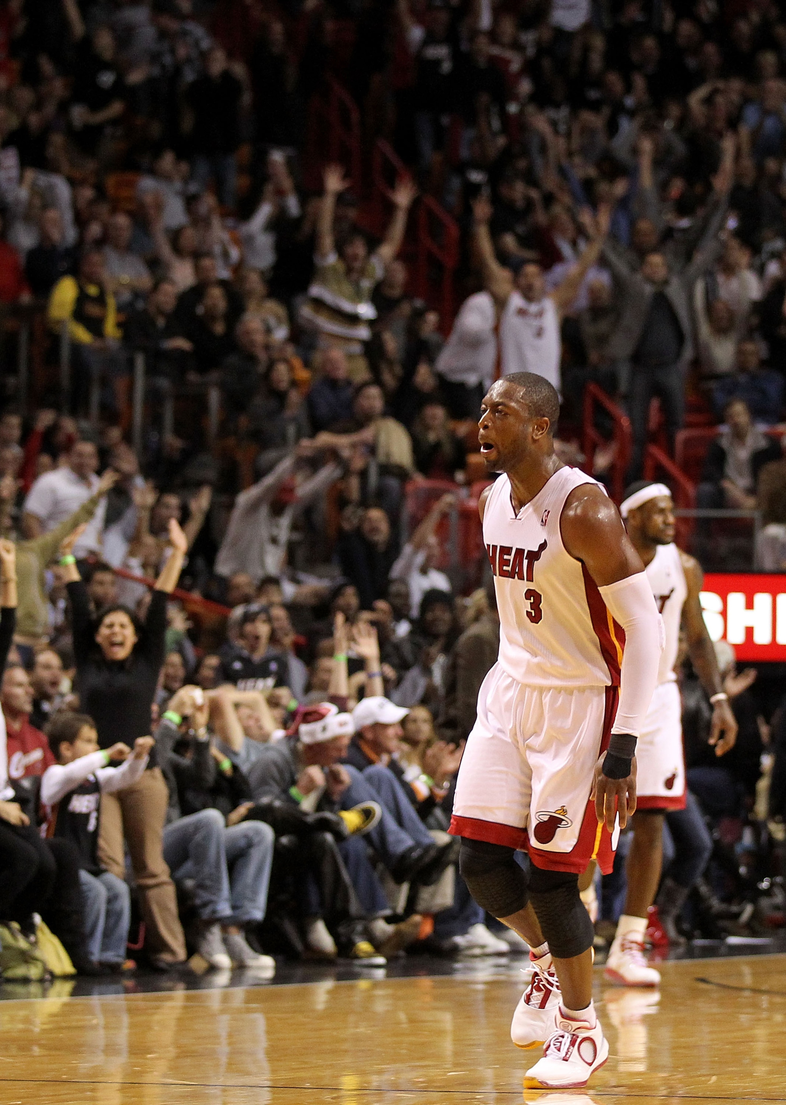 MIAMI, FL - DECEMBER 15:  Dwyane Wade #3 of the Miami Heat reacts after making a 3 pointer during a game against the Cleveland Cavaliers at American Airlines Arena on December 15, 2010 in Miami, Florida. NOTE TO USER: User expressly acknowledges and agree