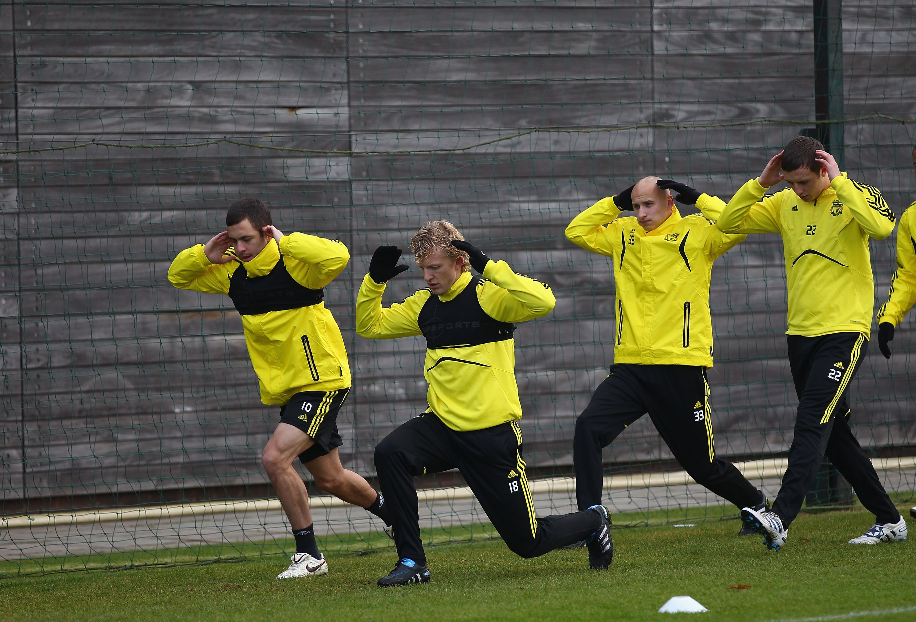 LIVERPOOL, ENGLAND - DECEMBER 14:  Dirk Kuyt and Joe Cole of Liverpool lead the way warming up during a training session ahead of their UEFA Europa League Group K match against Utrecht at Melwood Training Ground on December 14, 2010 in Liverpool, England.