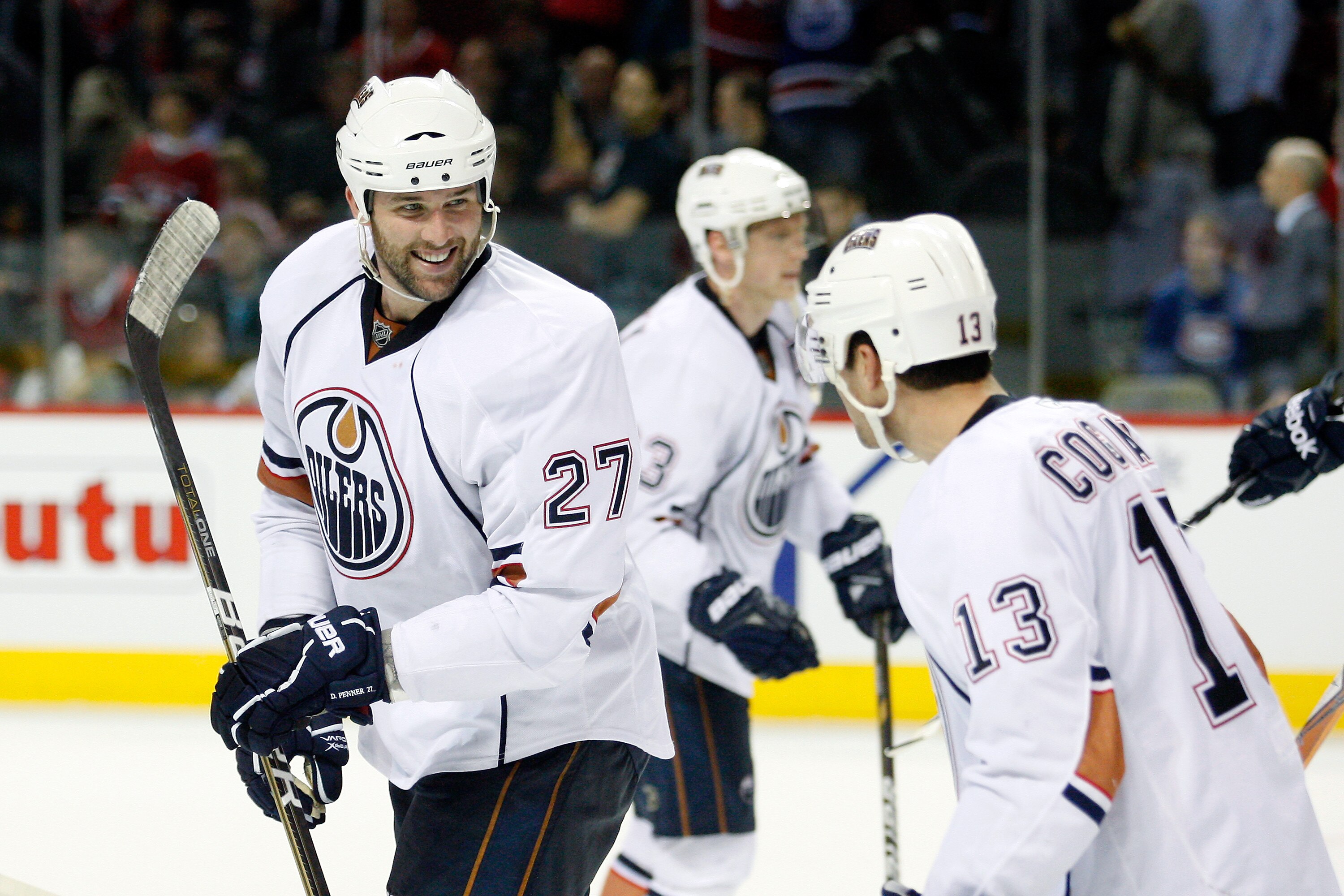 MONTREAL, CANADA - DECEMBER 01:  Dustin Penner #27 of the Edmonton Oilers celebrates with team mates after scoring the game winning goal during the NHL game against the Montreal Canadiens at the Bell Centre on December 1, 2010 in Montreal, Quebec, Canada.