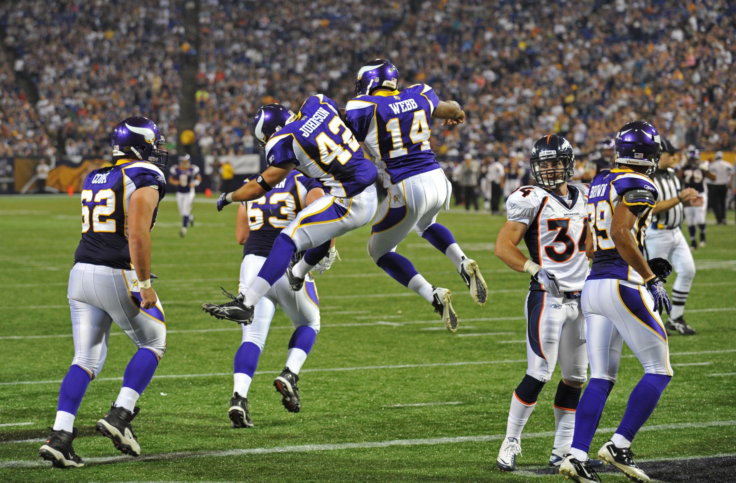 MINNEAPOLIS - SEPTEMBER 02:  Ian Johnson #42 and Joe Webb #14 of the Minnesota Vikings celebrate a touchdown during an NFL preseason game against the Denver Broncos at the Mall of America Field at Hubert H. Humphrey Metrodome, on September 2, 2010 in Minn