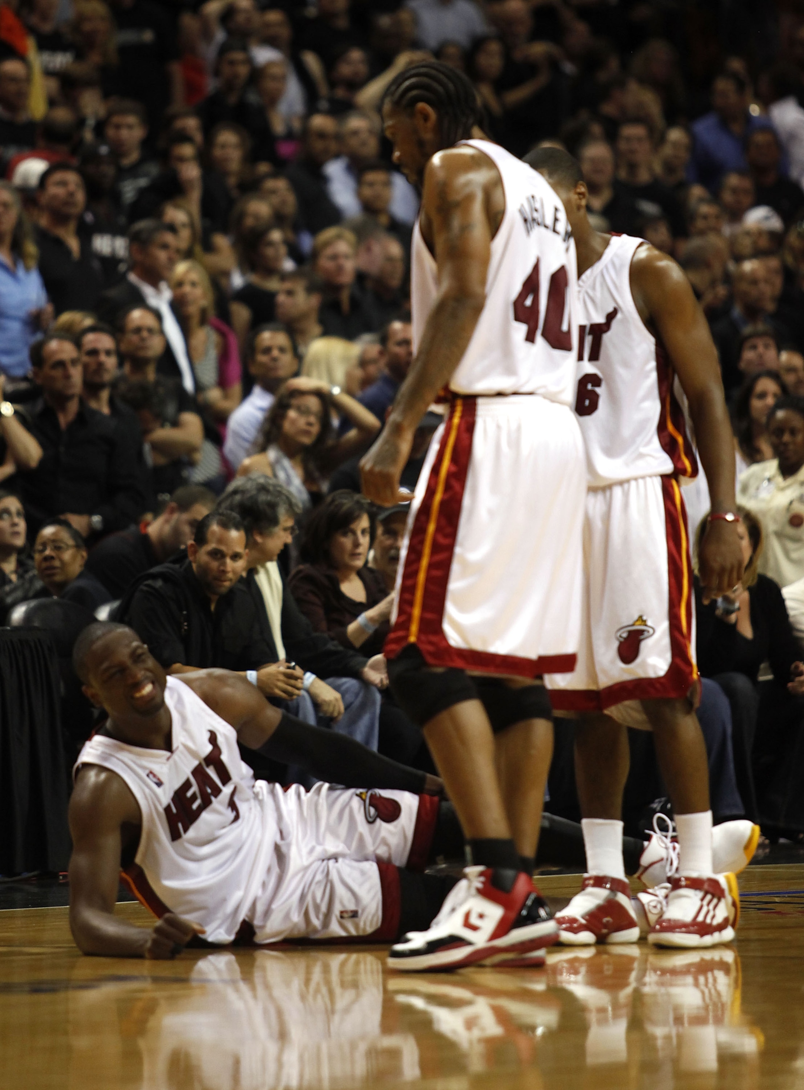 MIAMI - APRIL 23:  Guard Dwyane Wade #3 of the Miami Heat stays on the floor injured during a 100-98 loss to the Boston Celtics in Game Three of the Eastern Conference Quarterfinals during the 2010 NBA Playoffs at American Airlines Arena on April 23, 2010