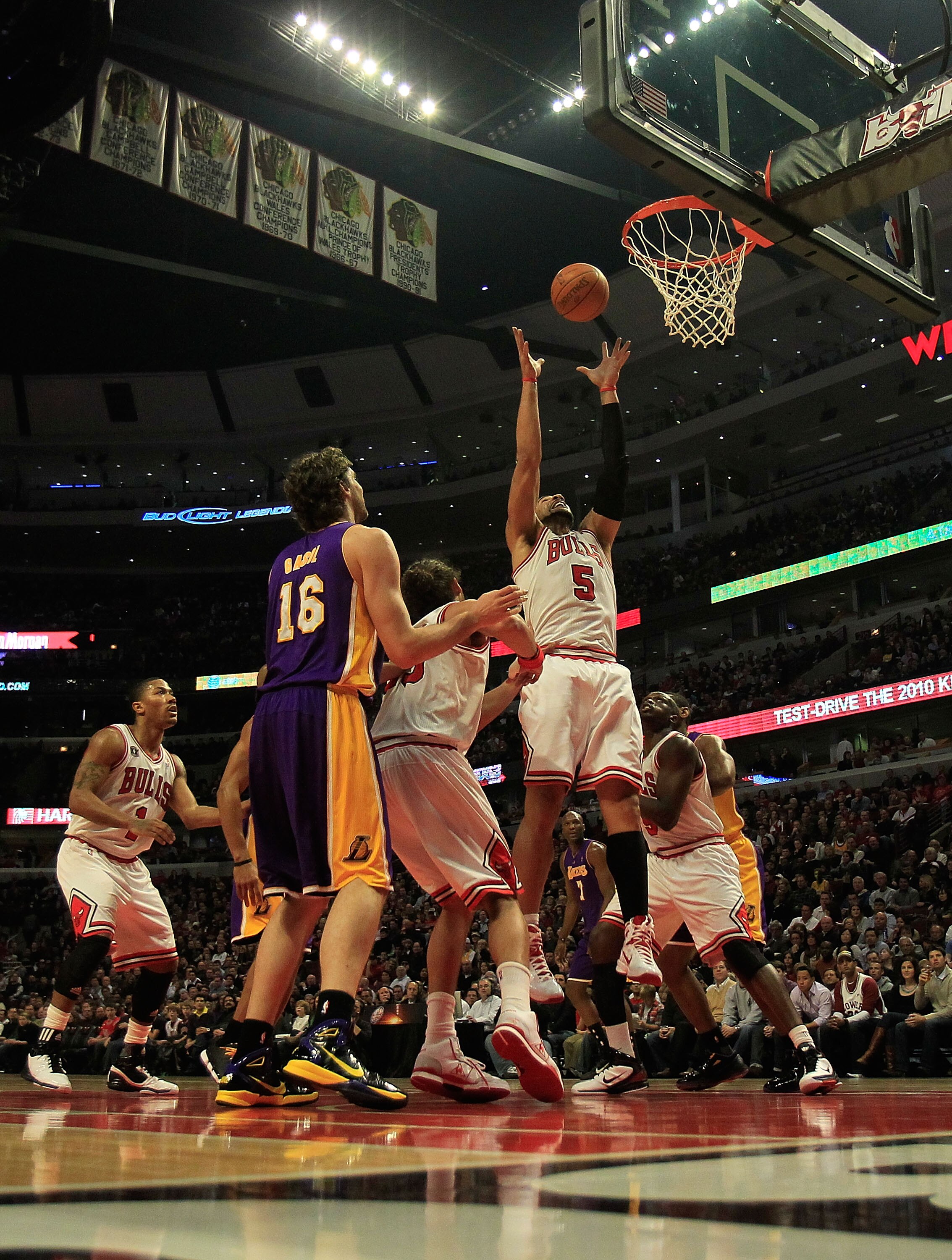 CHICAGO, IL - DECEMBER 10: Carlos Boozer #5 of the Chicago Bulls leaps for a rebound against the Los Angeles Lakers at the United Center on December 10, 2010 in Chicago, Illinois. The Bulls defeated the Lakers 88-84. NOTE TO USER: User expressly acknowled