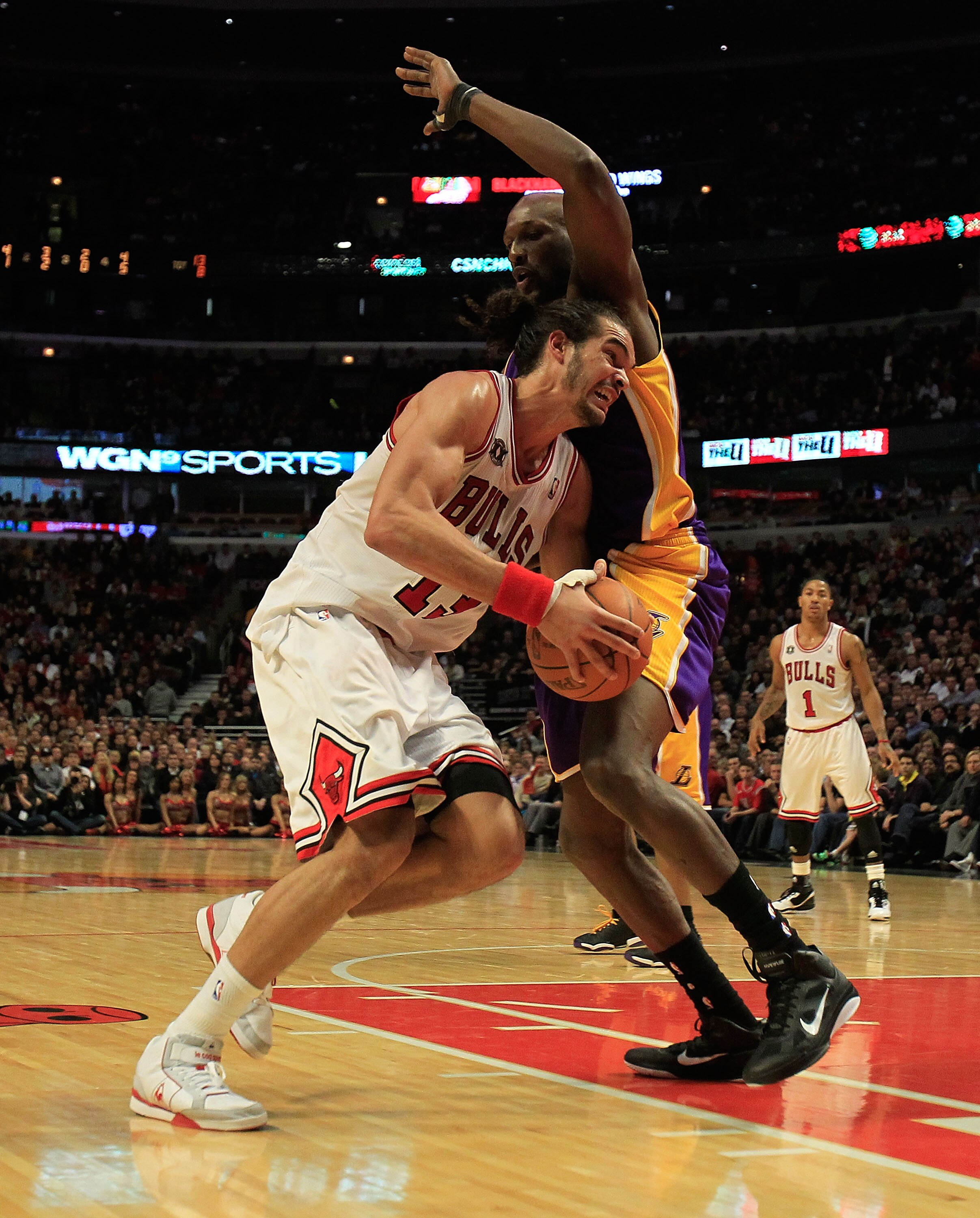 CHICAGO, IL - DECEMBER 10: Joakim Noah #13 of the Chicago Bulls drives against Lamar Odom #7 of the Los Angeles Lakers at the United Center on December 10, 2010 in Chicago, Illinois. The Bulls defeated the Lakers 88-84. NOTE TO USER: User expressly acknow