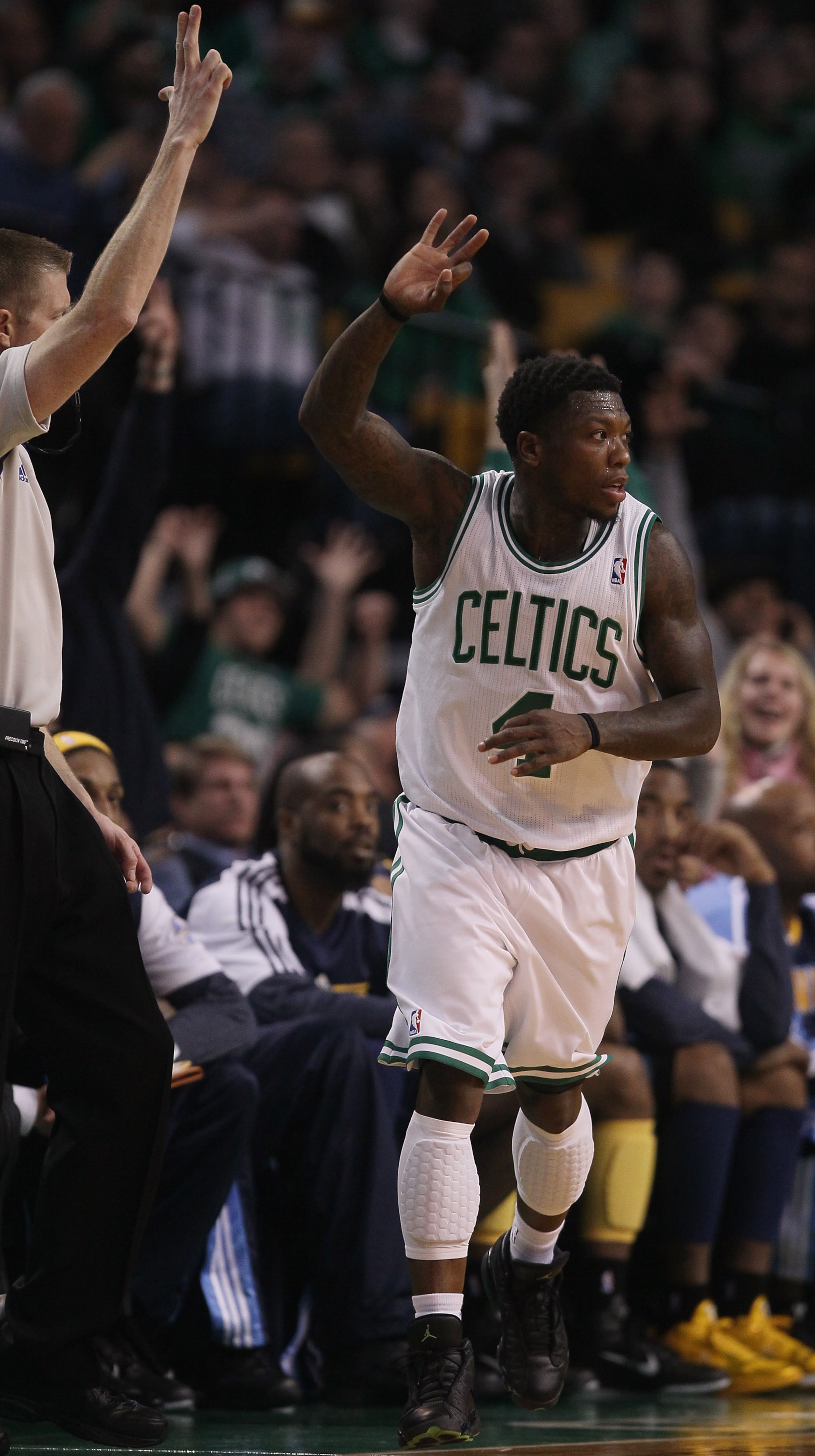 BOSTON, MA - DECEMBER 08:  Nate Robinson #4 of the Boston Celtics celebrates his three point basket in the second half against the Denver Nuggets on December 8, 2010 at the TD Garden in Boston, Massachusetts. The Celtics defeated the Nuggets 105-89. NOTE 