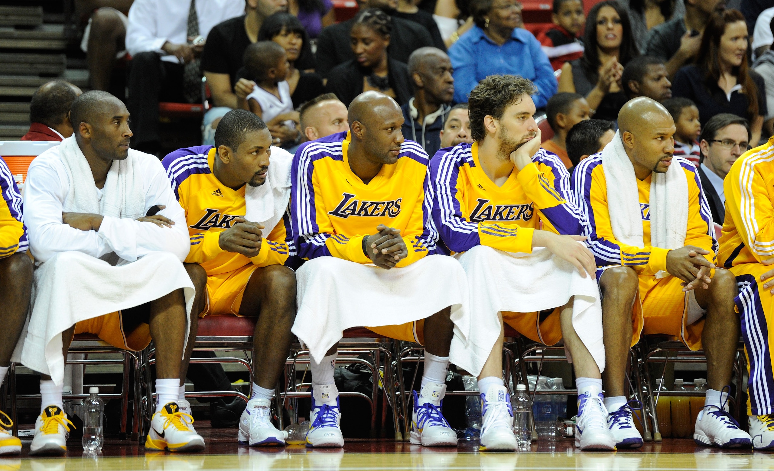 LAS VEGAS - OCTOBER 13: (L-R) Kobe Bryant #24, Ron Artest #15, Lamar Odom #7, Pau Gasol #16 and Derek Fisher #2 of the Los Angeles Lakers watch from the bench during a preseason game against the Sacramento Kings at the Thomas & Mack Center October 13, 20 LAS VEGAS - OCTOBER 13: (L-R) Kobe Bryant #24, Ron Artest #15, Lamar Odom #7, Pau Gasol #16 and Derek Fisher #2 of the Los Angeles Lakers watch from the bench during a preseason game against the Sacramento Kings at the Thomas & Mack Center October 13, 20