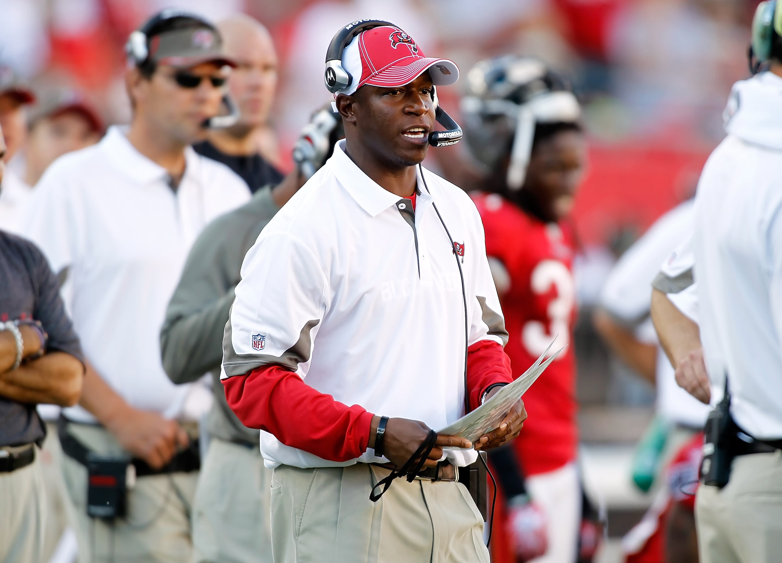 TAMPA, FL - NOVEMBER 14:  Head coach Raheem Morris of the Tampa Bay Buccaneers talks with the coaches in the pressbox during the game against the Carolina Panthers at Raymond James Stadium on November 14, 2010 in Tampa, Florida.  (Photo by J. Meric/Getty 