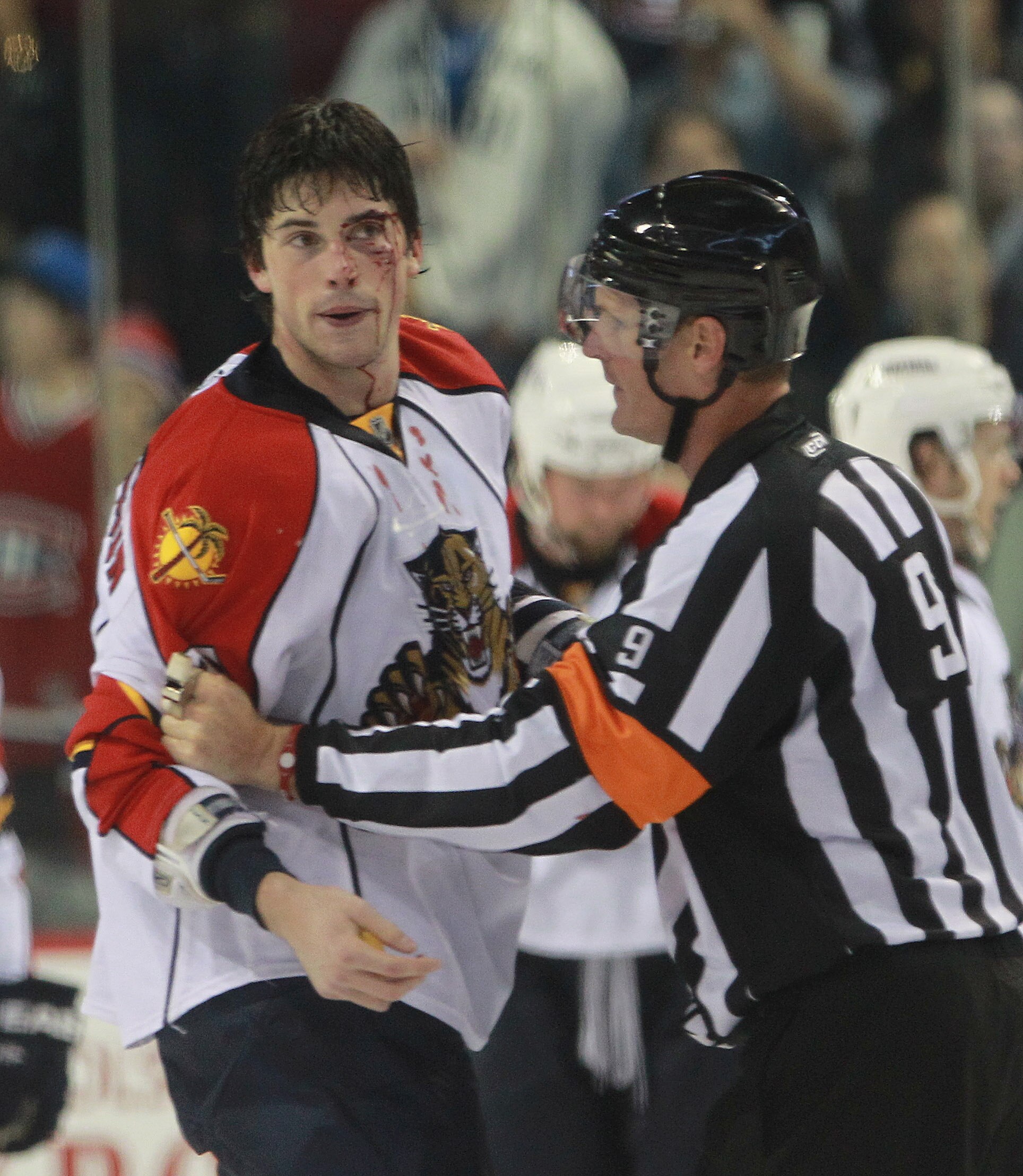 MONTREAL, QC - SEPTEMBER 27:  Erik Gudbranson #44 of the Florida Panthers is held by referee Dan O'Rourke #9 following his fight with Travis Moen #32 of the Montreal Canadiens at the Bell Centre on September 27, 2010 in Montreal, Canada. The Canadiens def