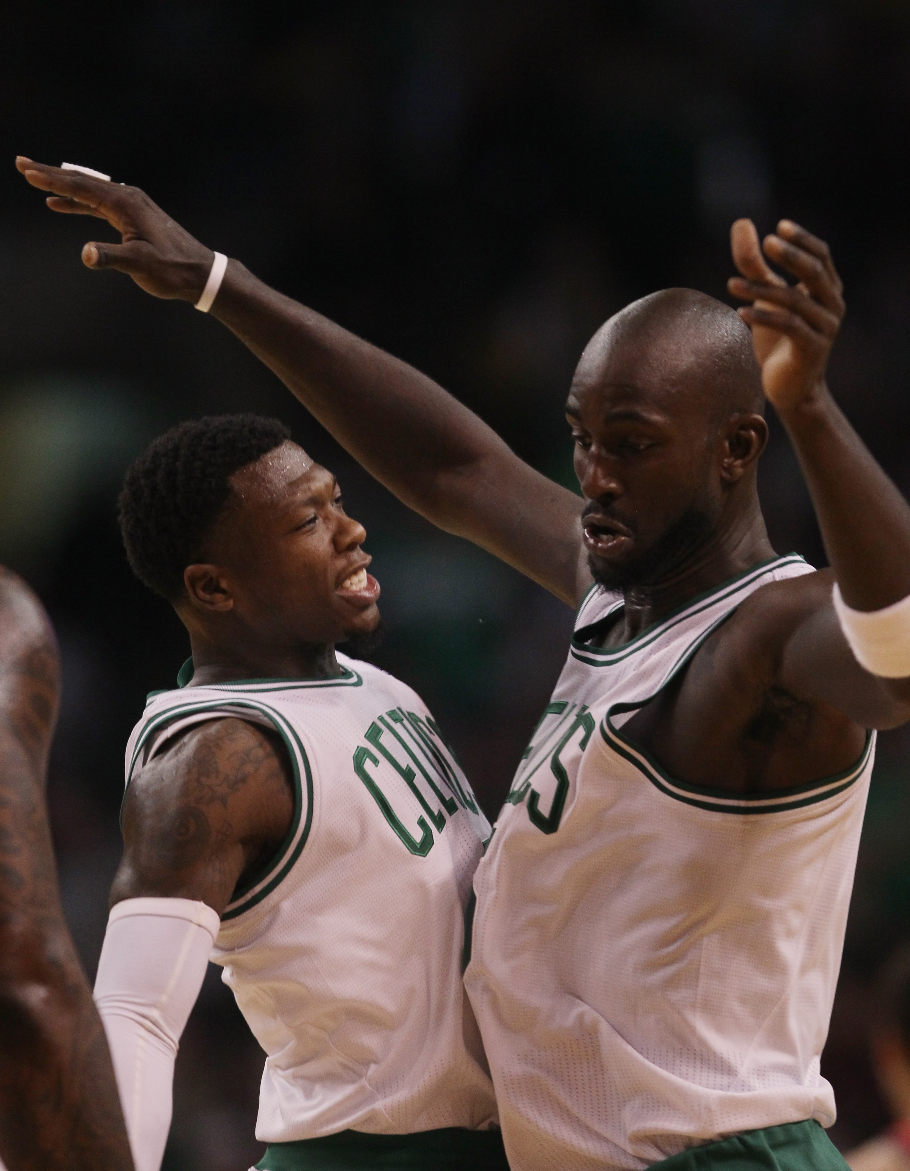 BOSTON - NOVEMBER 24:  Nate Robinson #4 and Kevin Garnett #5 of the Boston Celtics celebrate Garnett's shot in the fourth quarter against the New Jersey Nets on November 24, 2010 at the TD Garden in Boston, Massachusetts. The Celtics defeated the nets 89-