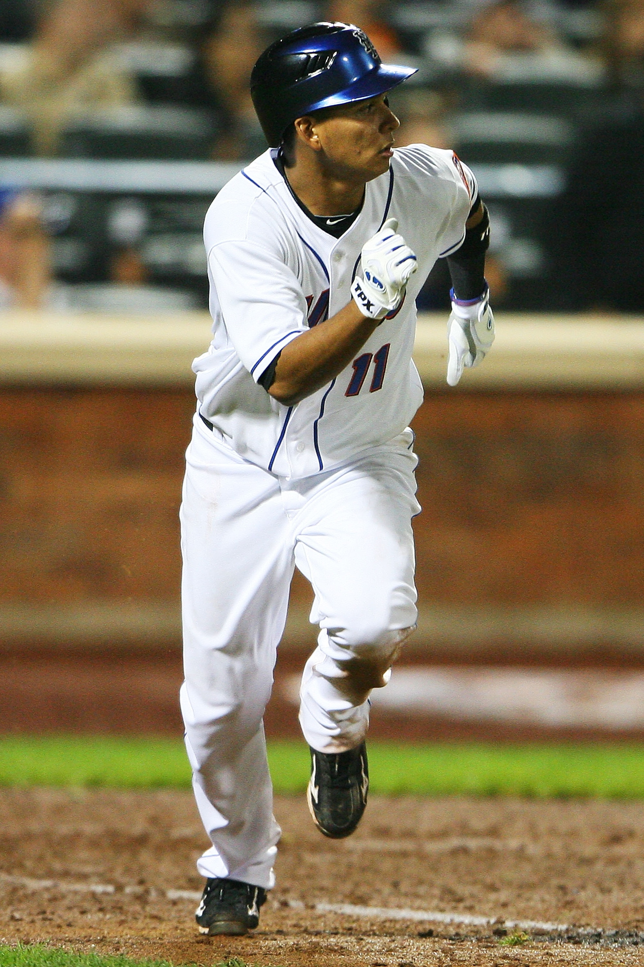 NEW YORK - SEPTEMBER 28:  Ruben Tejada #11 of the New York Mets runs after hitting a walk off two run double in the ninth inning, which helped defeat the Milwaukee Brewers 4 - 3 on September 28, 2010 at Citi Field in the Flushing neighborhood of the Queen
