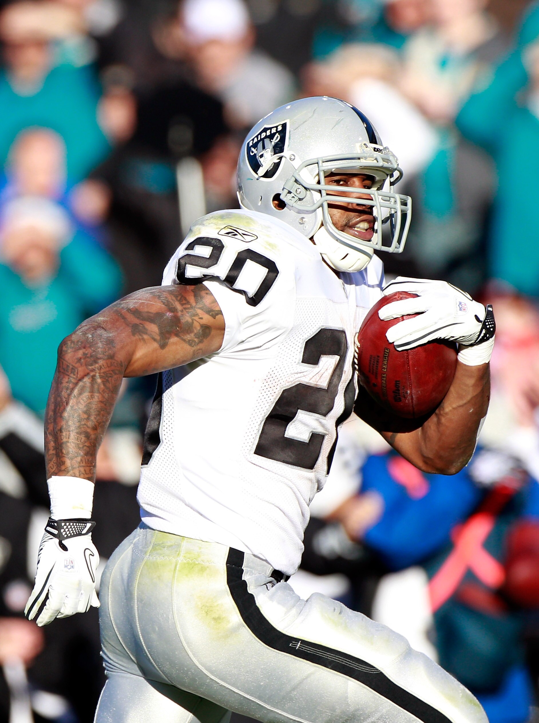 JACKSONVILLE, FL - DECEMBER 12:  Darren McFadden #20 of the Oakland Raiders runs for yardage during the game against the Jacksonville Jaguars at EverBank Field on December 12, 2010 in Jacksonville, Florida.  (Photo by Sam Greenwood/Getty Images)